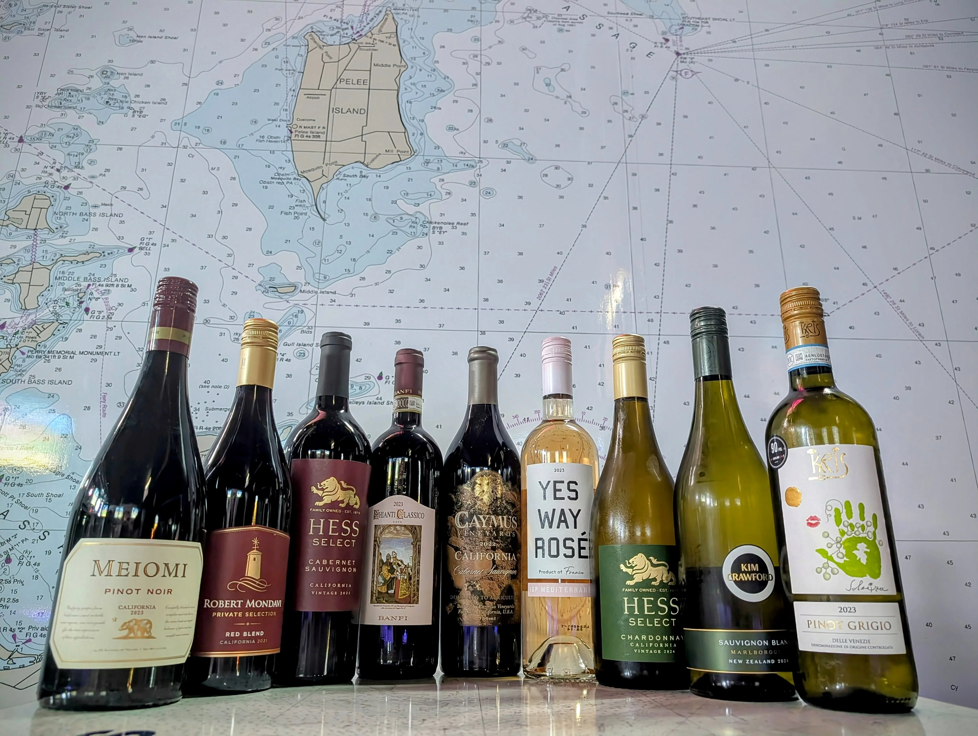 Selection of wines displayed against a nautical map