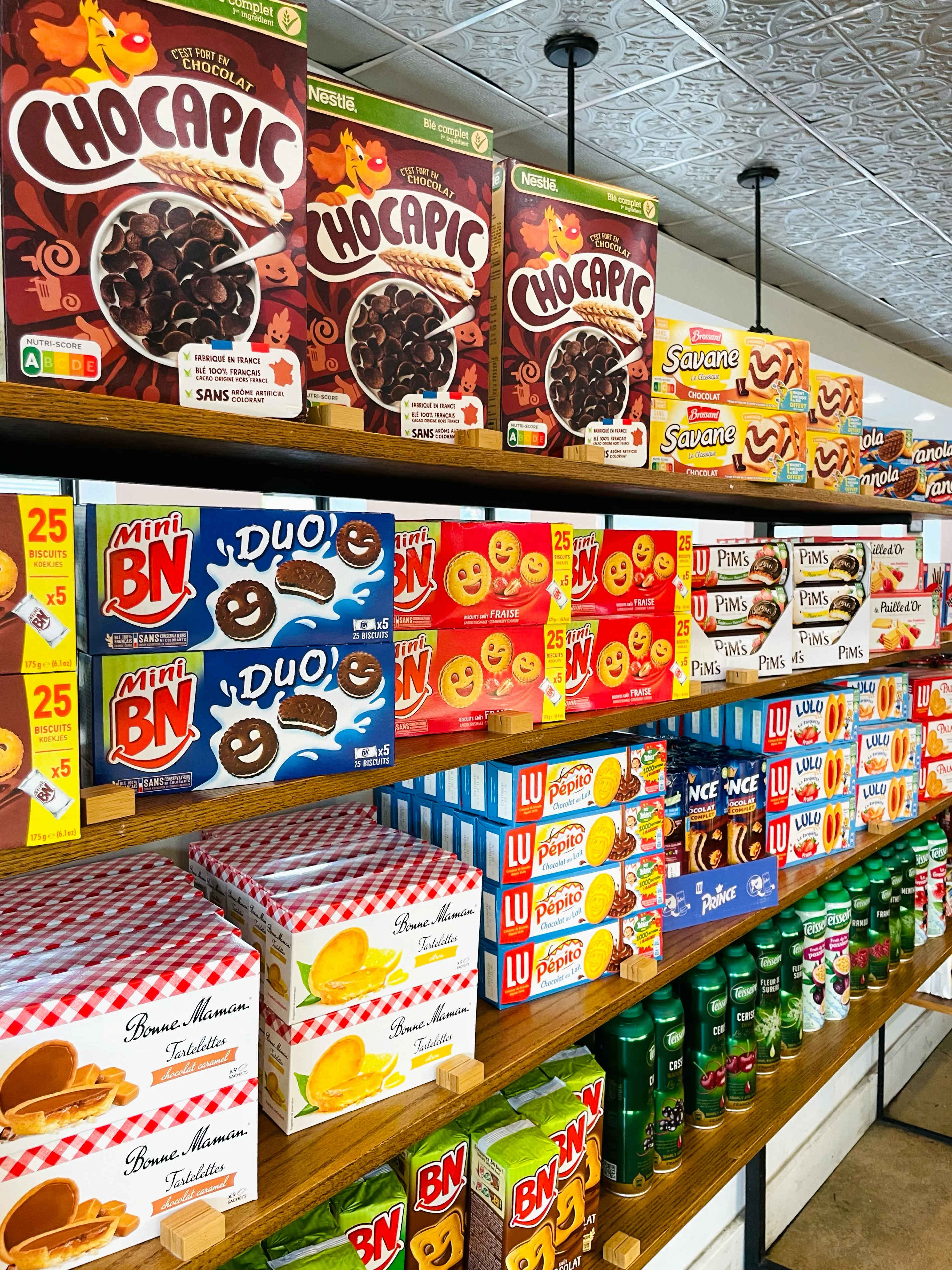 French retail products displayed on a shelf at La Boulangerie & Co Wilson, bringing a taste of France to Chicago.
