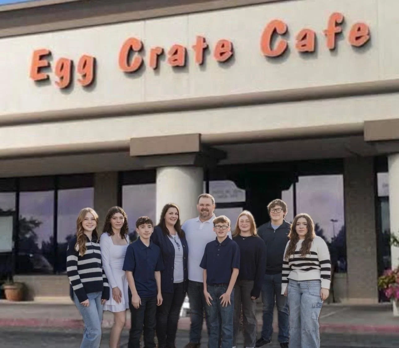 Family portrait outside Egg Crate Cafe