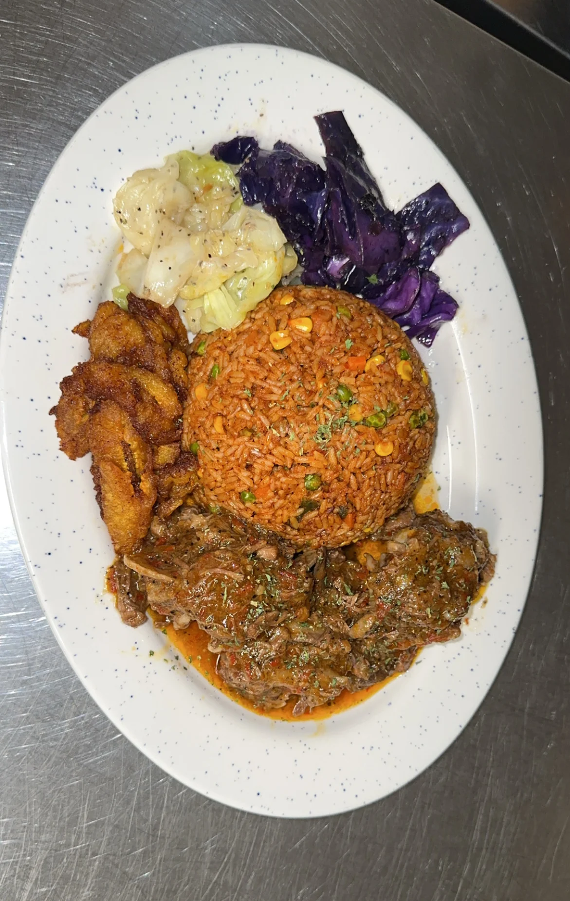 Nigerian jollof rice with beef and plantains