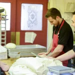 Bakers preparing dough in a cozy kitchen