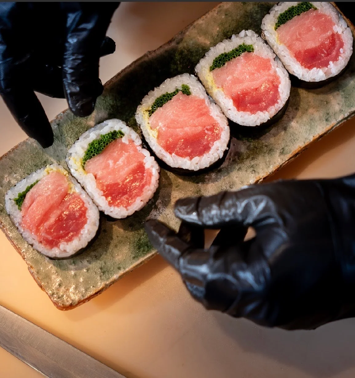 Artfully arranged sushi rolls on a ceramic plate