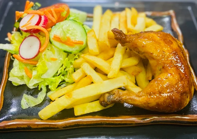 Grilled peri-peri chicken with fries and fresh salad