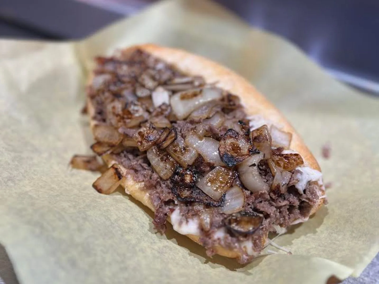 Philly cheesesteak sandwich with grilled onions