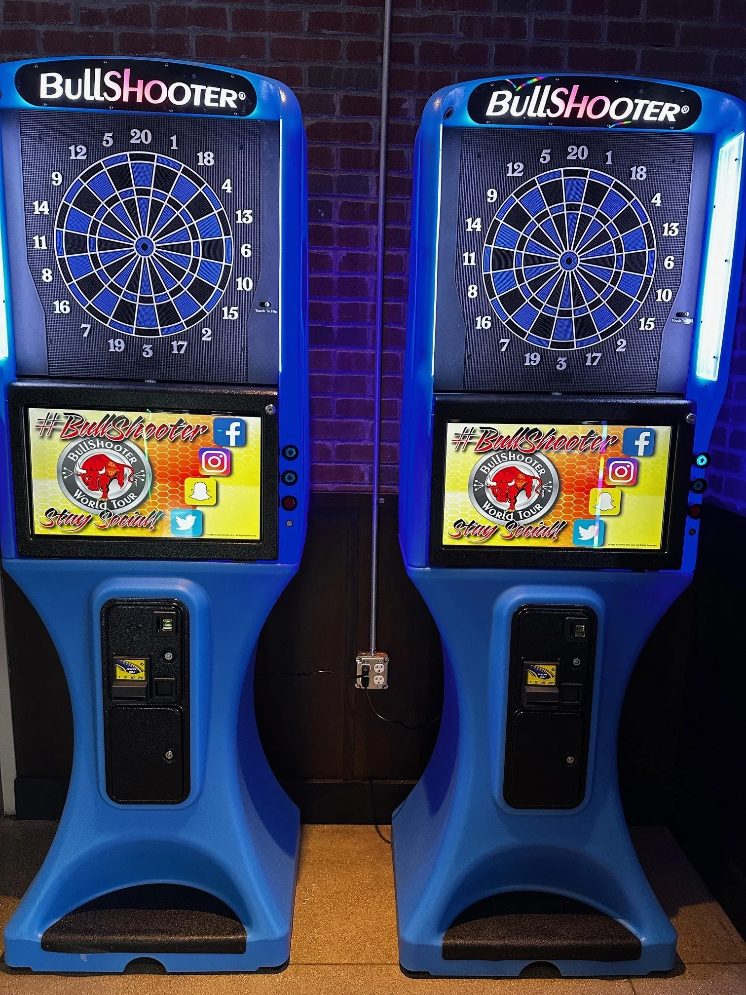 A vibrant dartboard with darts, set in a lively restaurant atmosphere.
