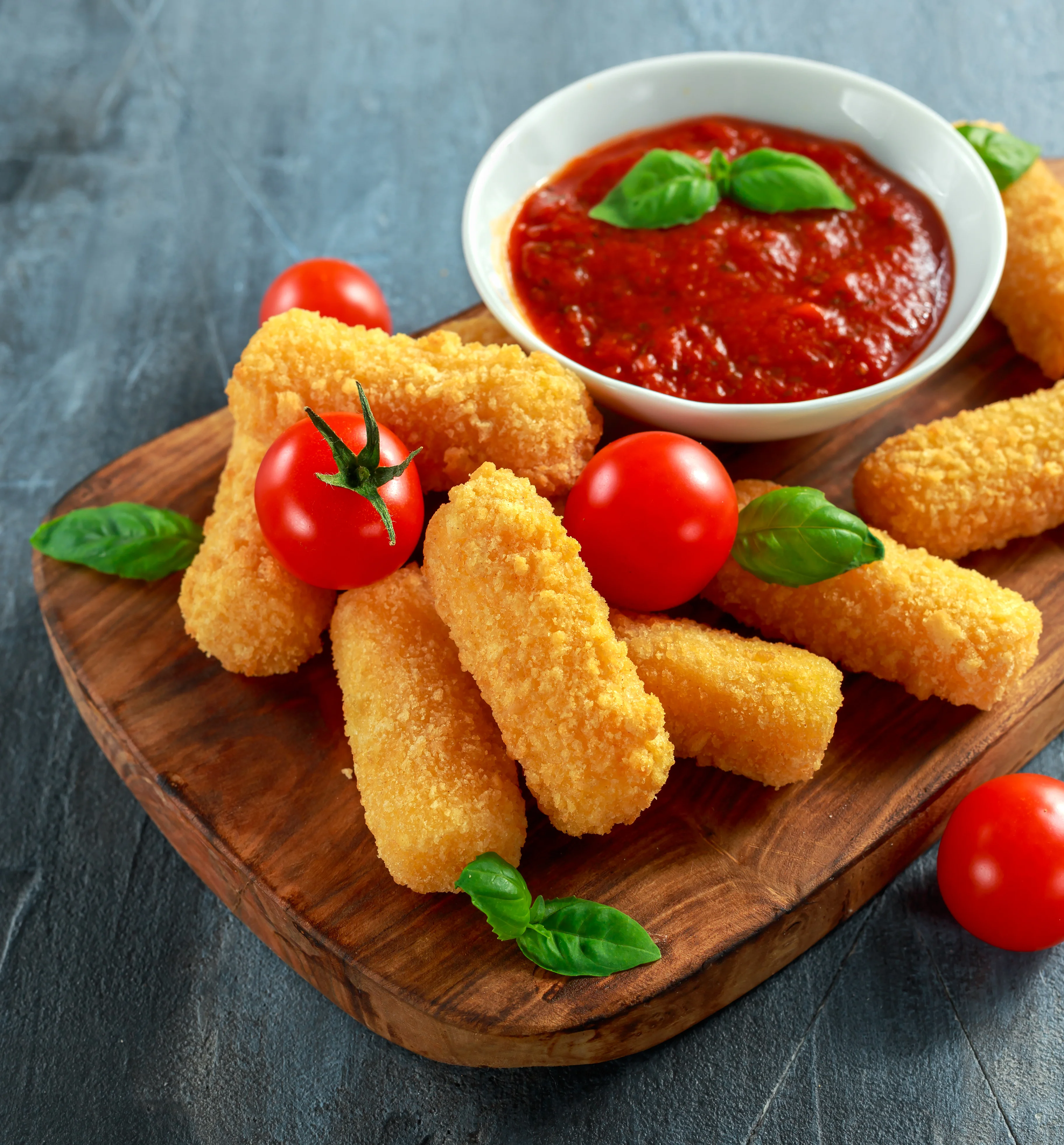 Crispy mozzarella sticks with marinara sauce