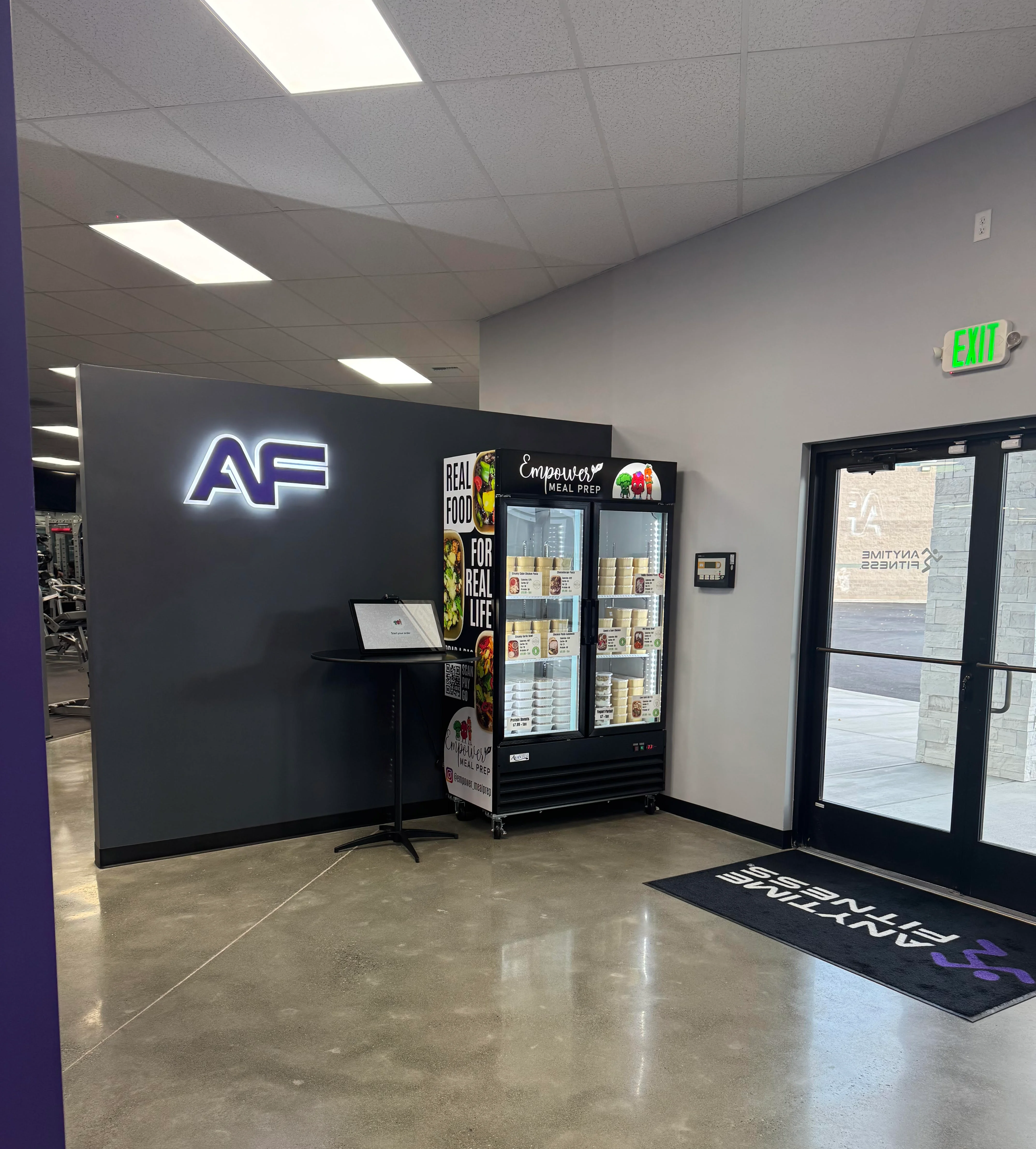 Modern gym entrance with fitness food fridge