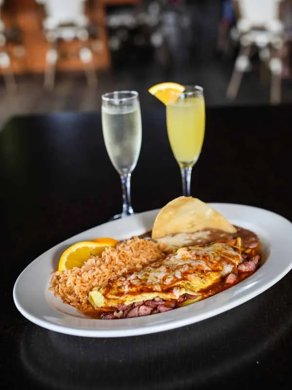 Delicious Mexican huevos rancheros with rice and mimosas