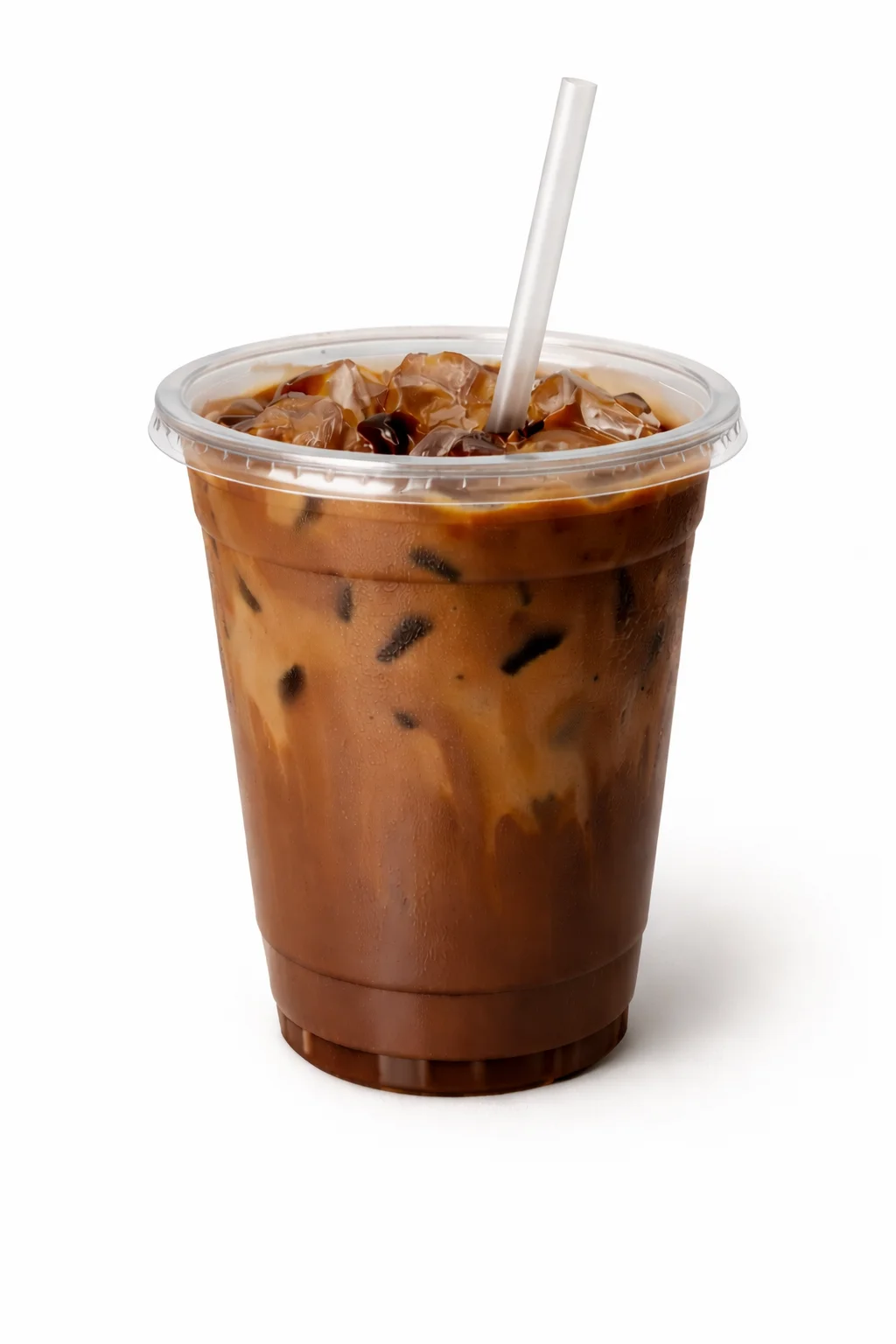 A clear plastic cup filled with iced coffee, featuring ice cubes and a straw.