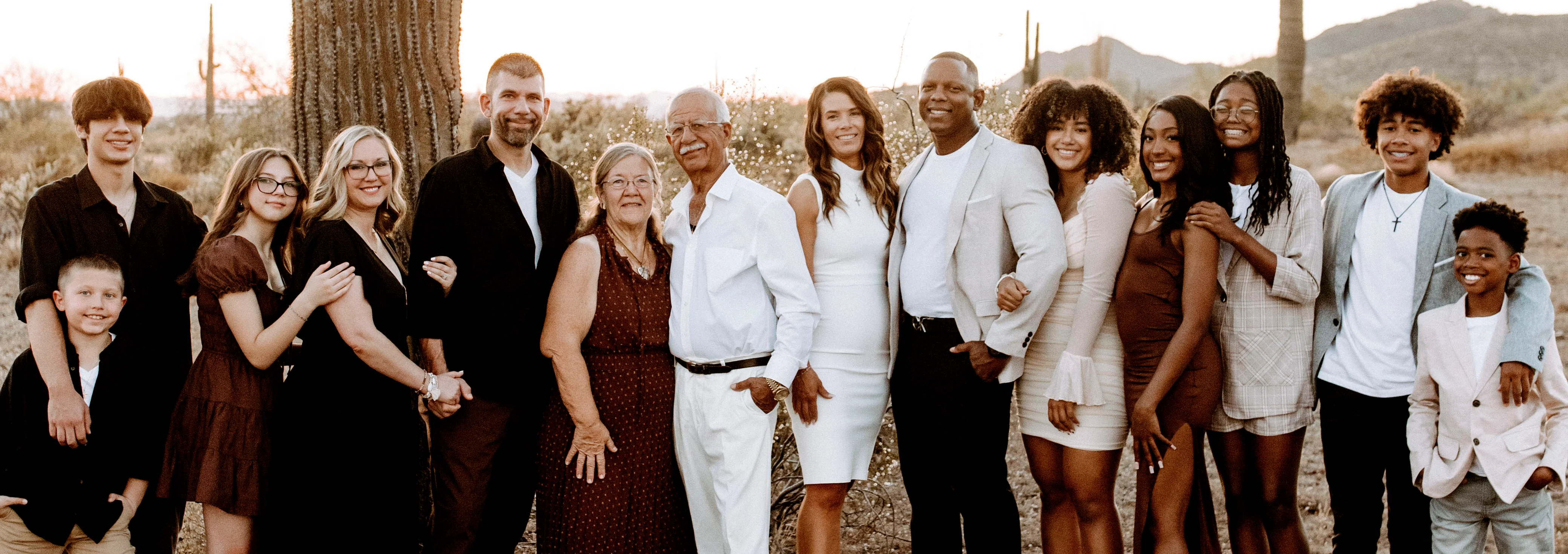 Family portrait in a desert landscape at sunset