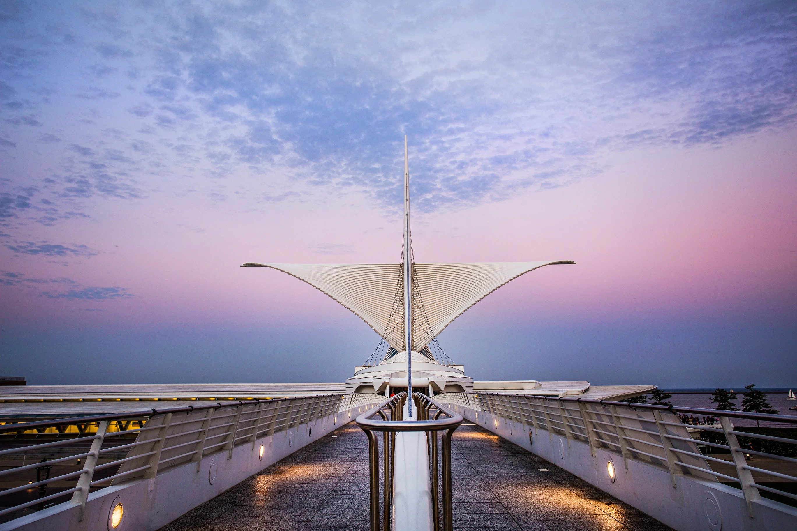 Milwaukee Art Museum exterior at night, showcasing its stunning architecture.