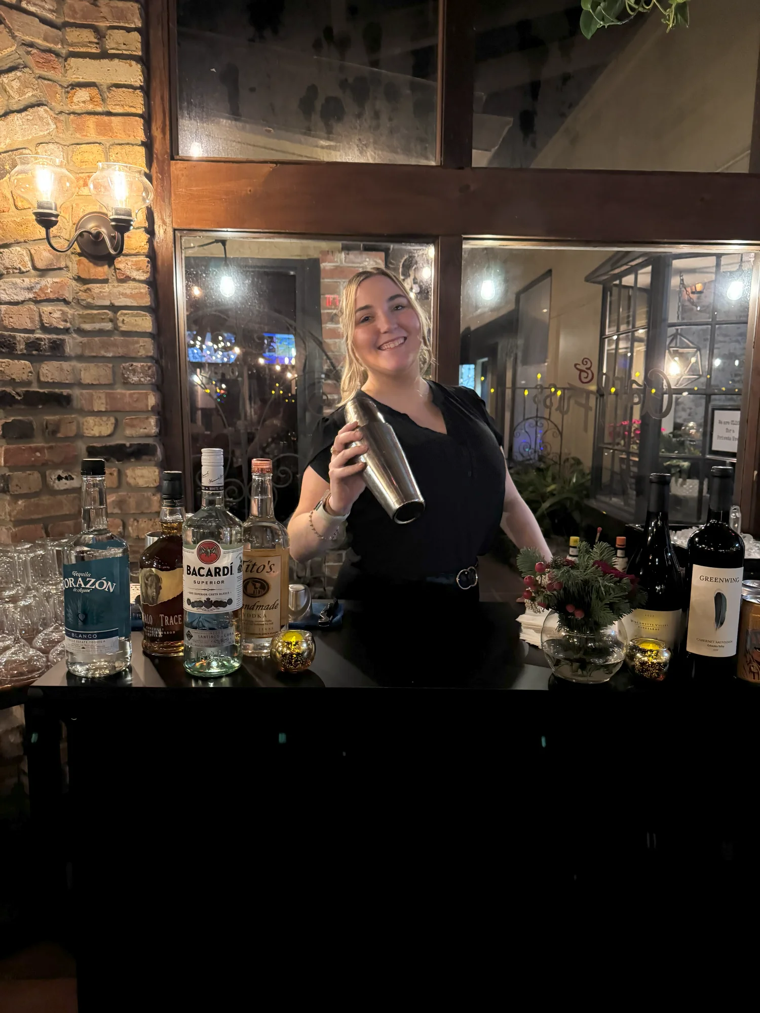 Bartender shaking a cocktail at a stylish bar