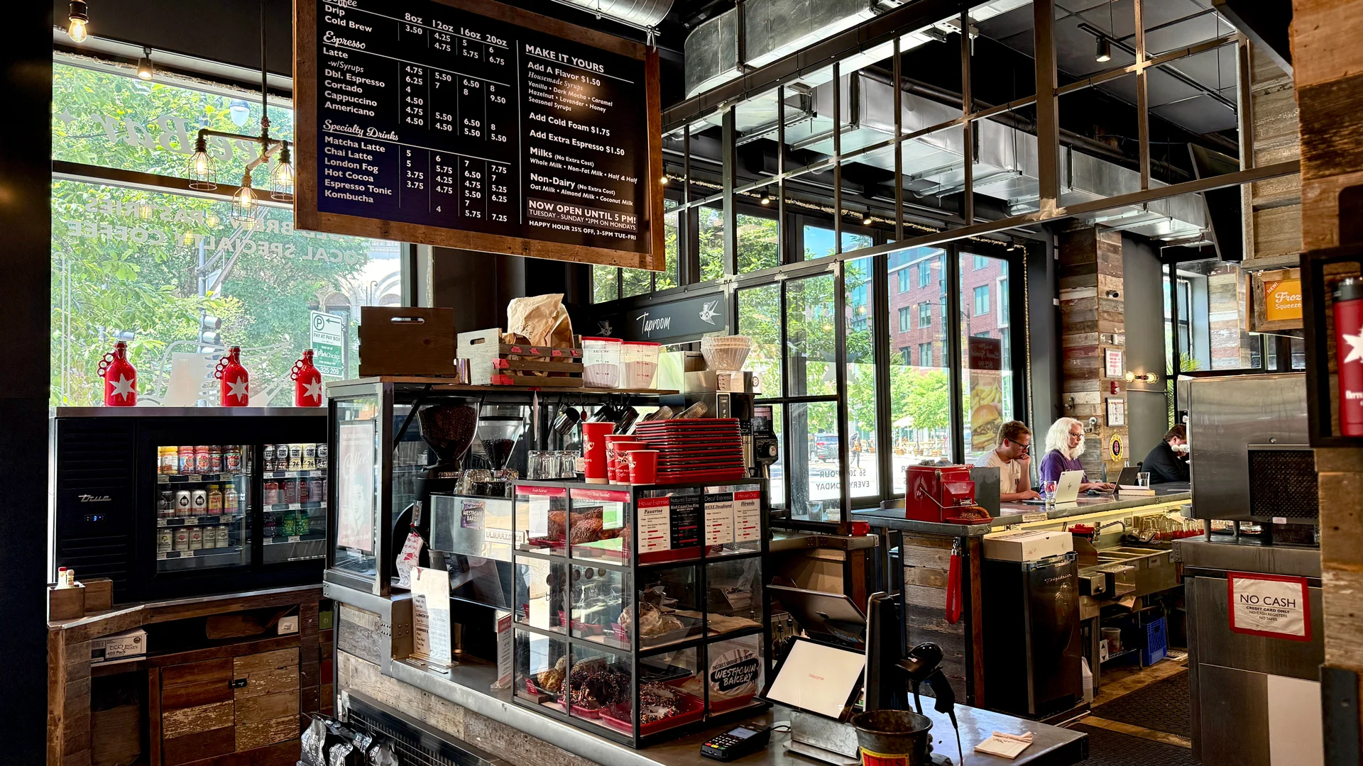 Modern coffee shop interior with menu and seating