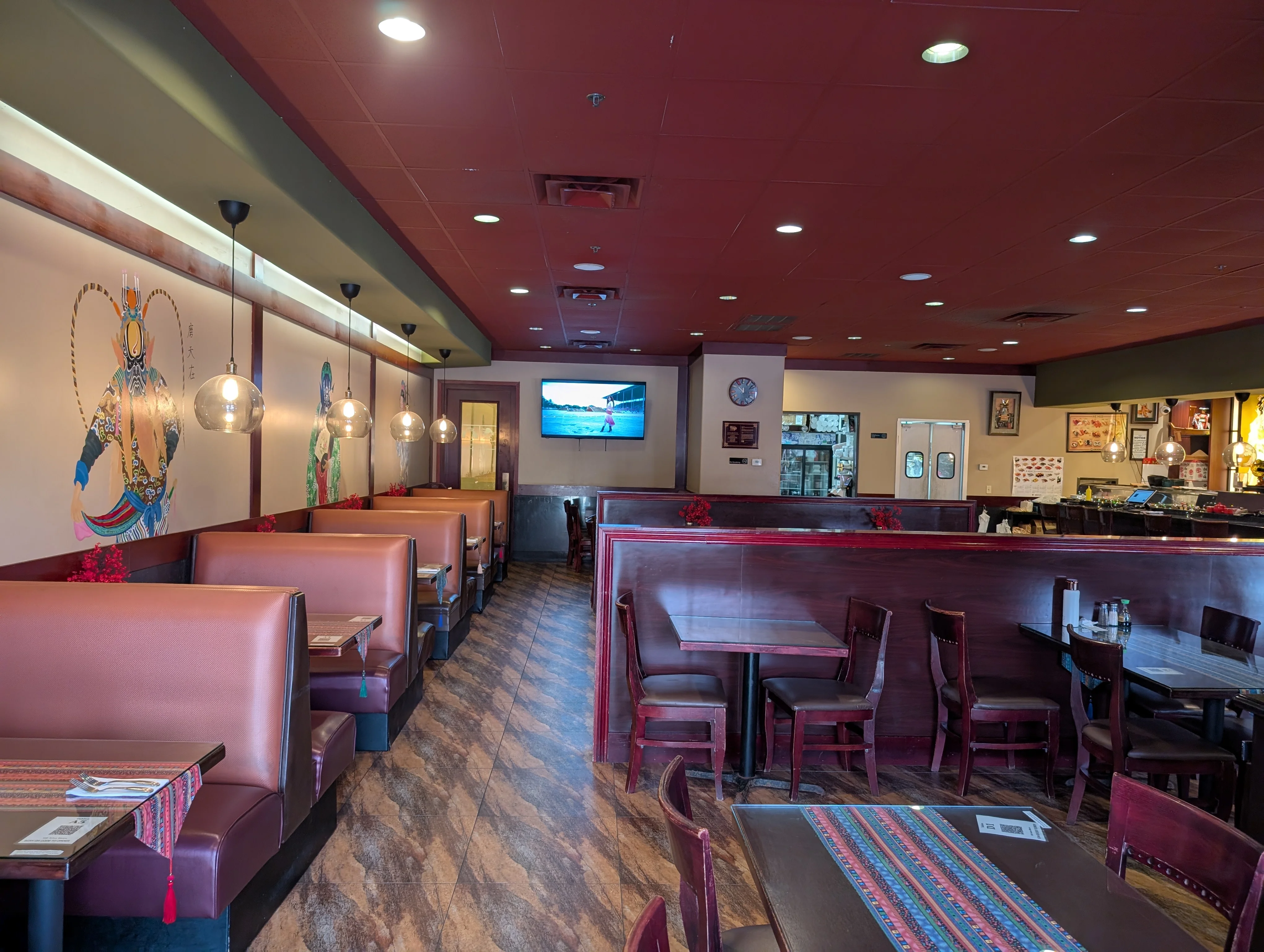 Cozy restaurant interior with warm lighting and artistic decor