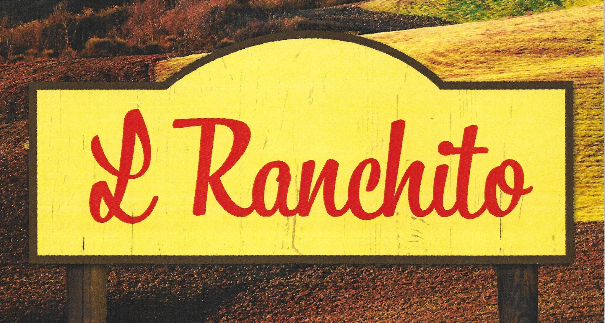 Sign for L Ranchito restaurant with rustic background