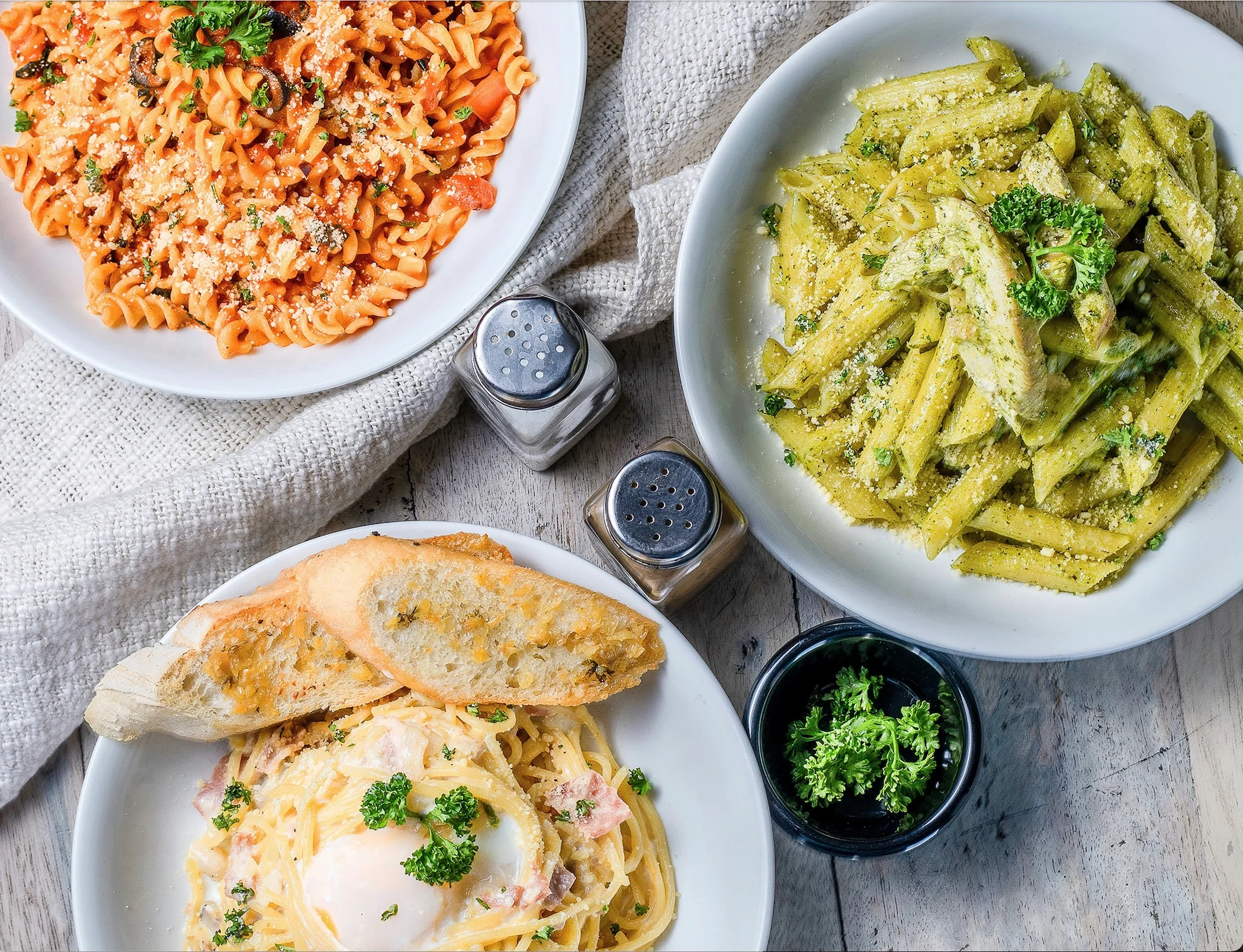 Italian pasta dishes including carbonara and pesto