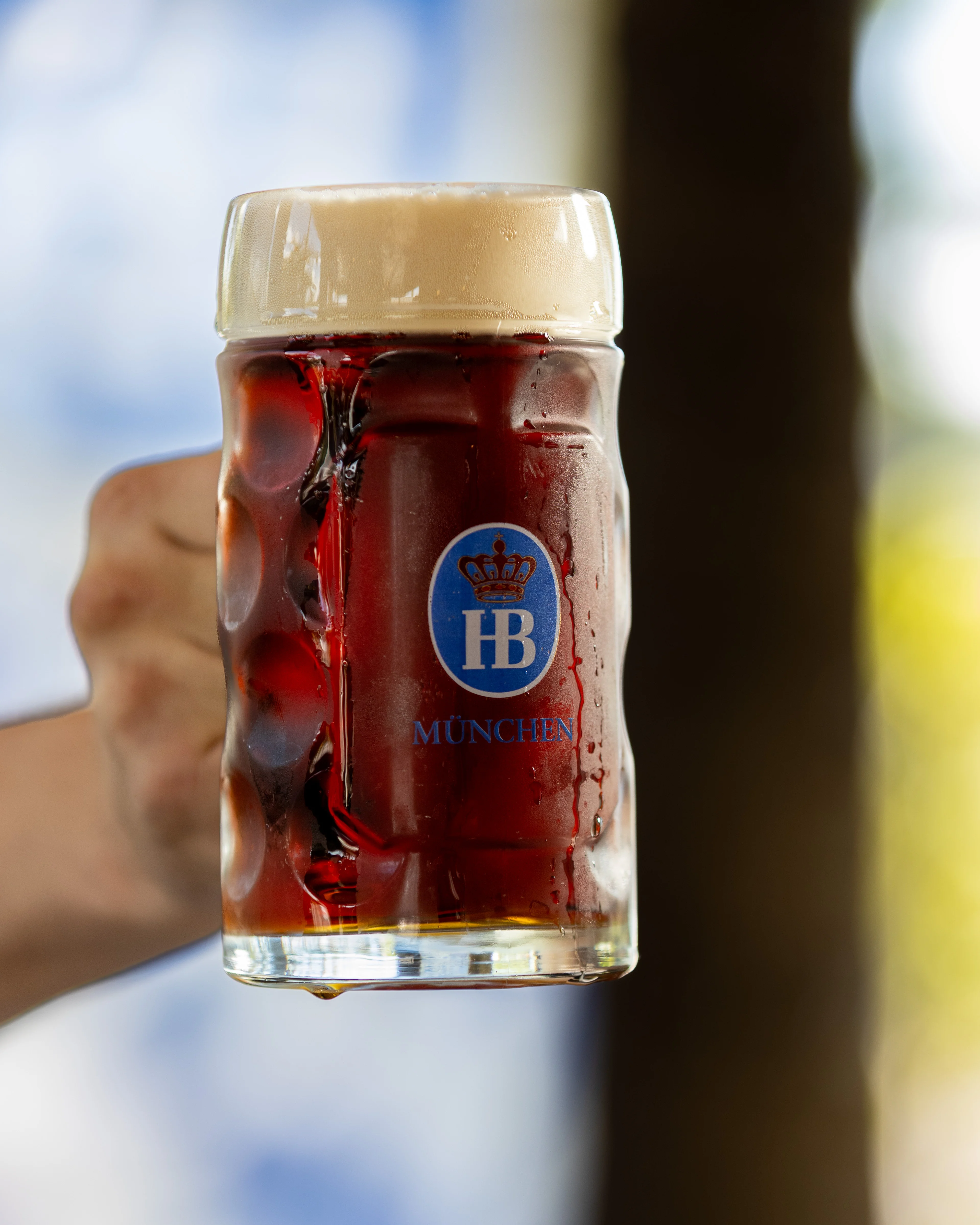 Frothy beer in a traditional German mug from Munich