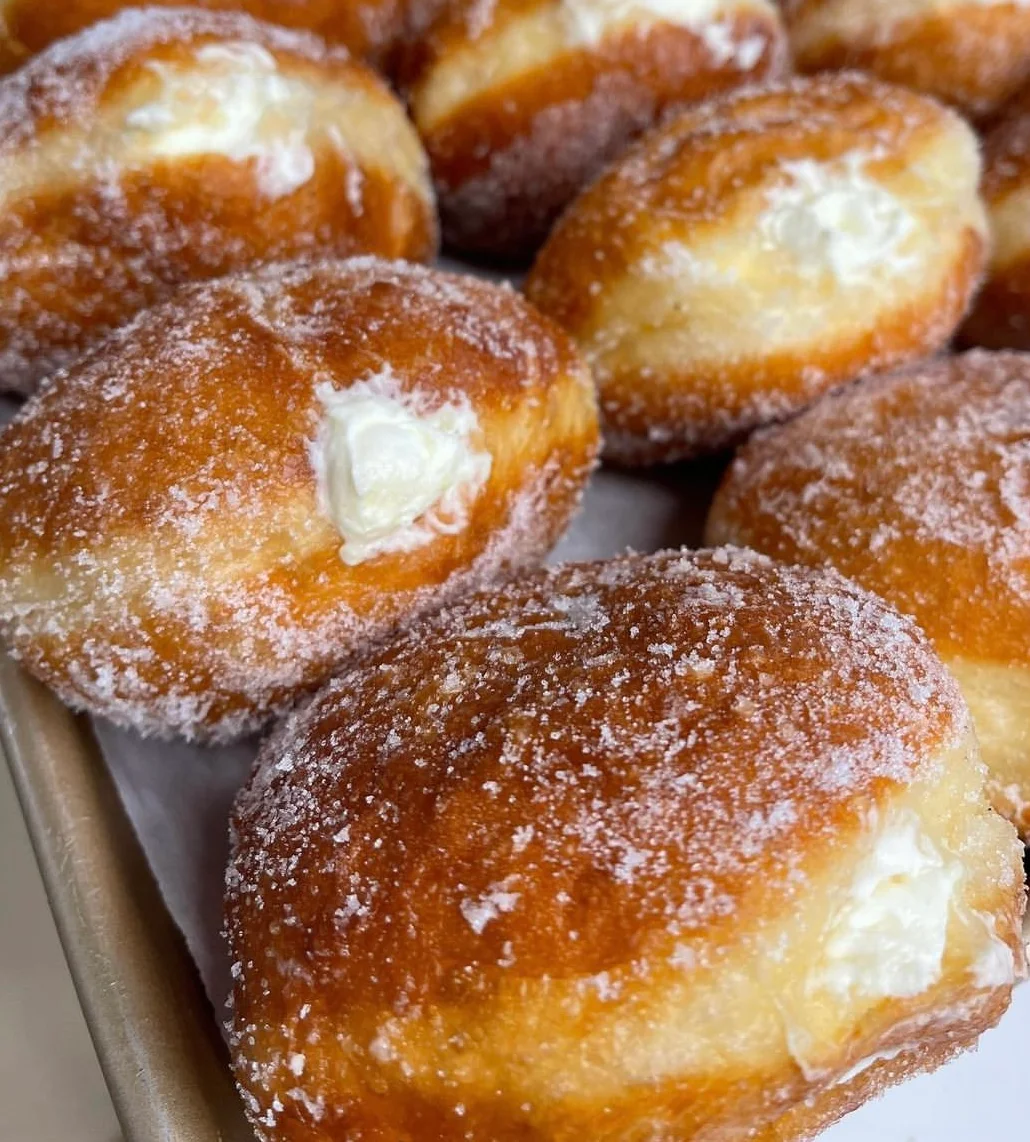 Delicious cream-filled doughnuts dusted with sugar