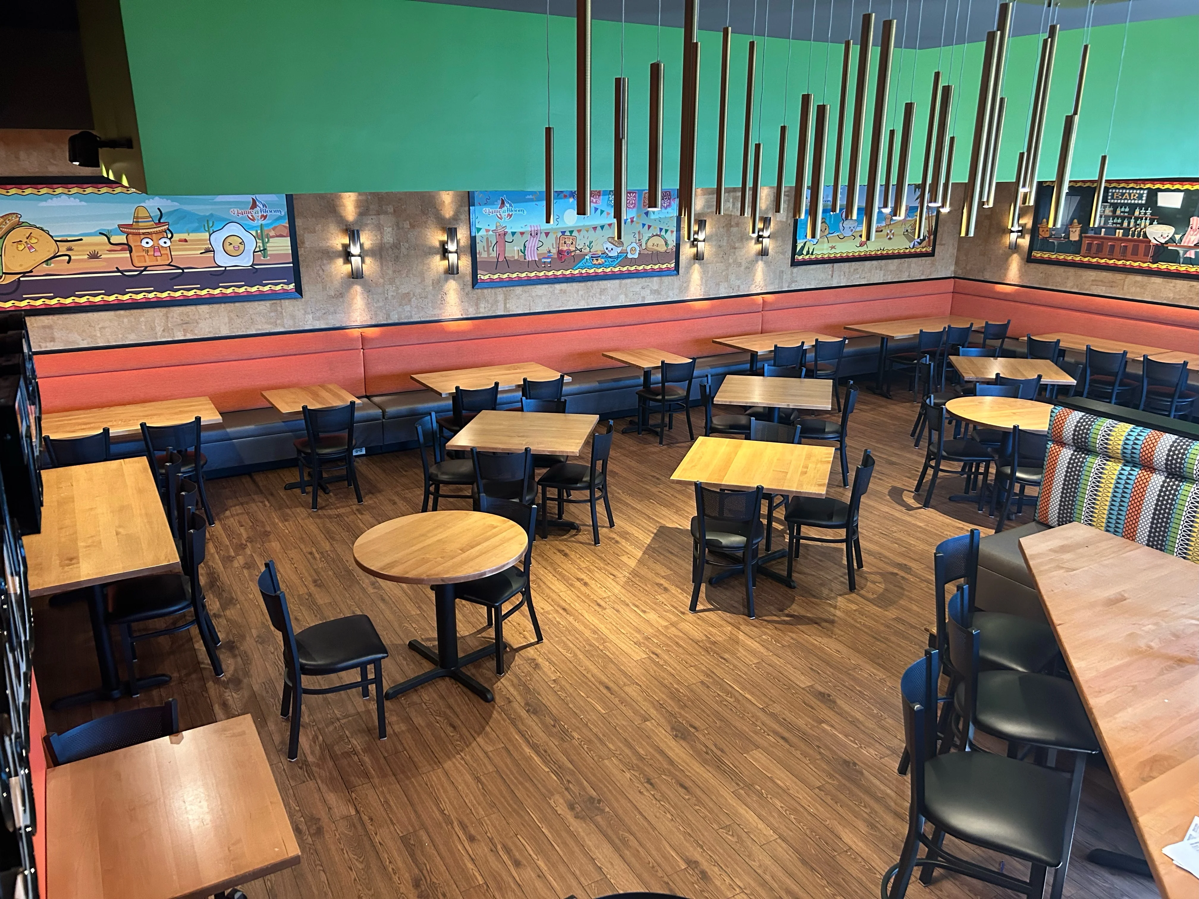 Vibrant restaurant interior with colorful decor and wooden tables