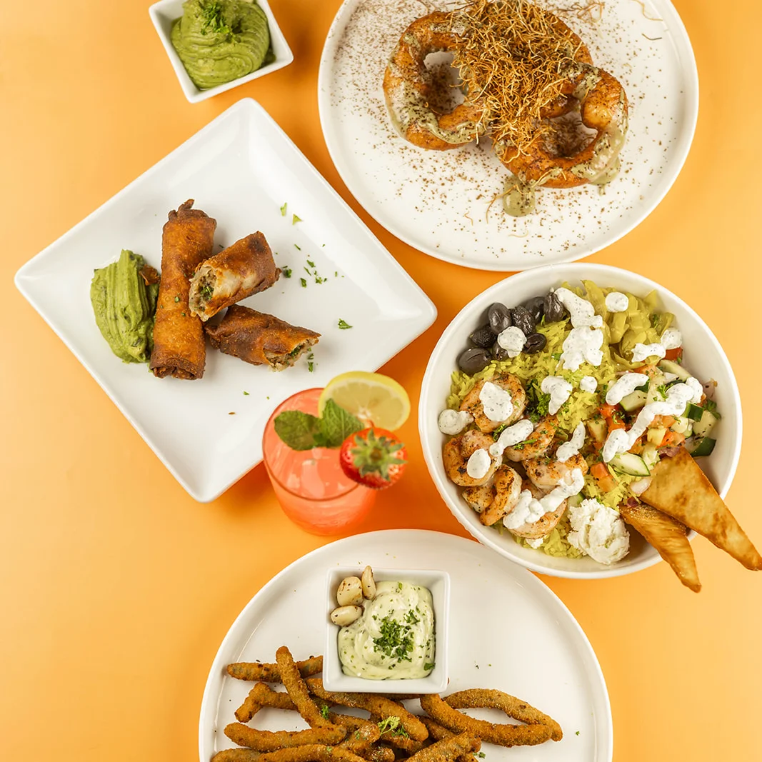 Santorini's menu spread featuring hummus, gyro rolls, Mediterranean rice bowl, and crispy sides