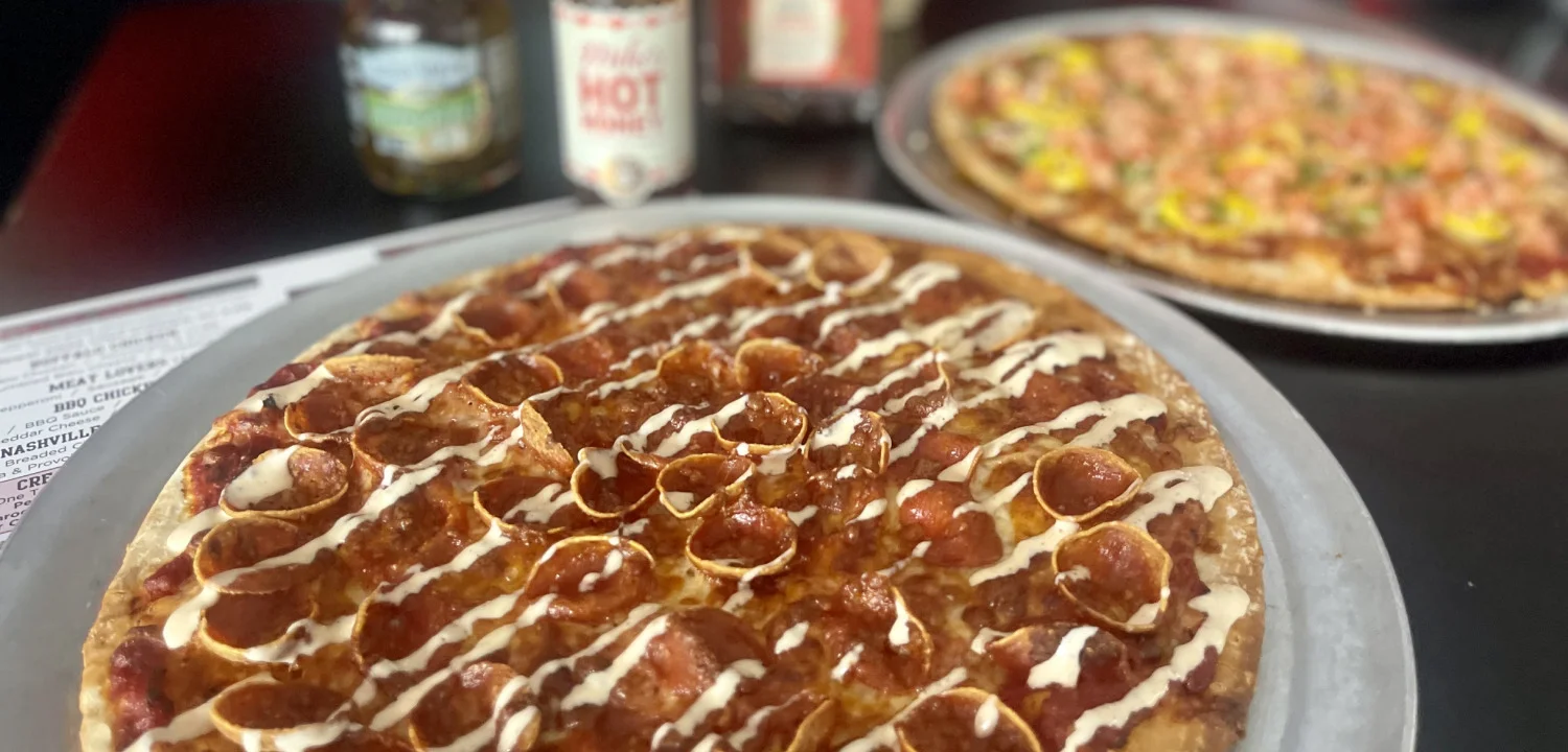 Pepperoni pizza drizzled with sauce