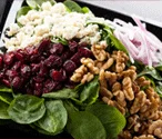 Fresh spinach salad with cranberries and walnuts