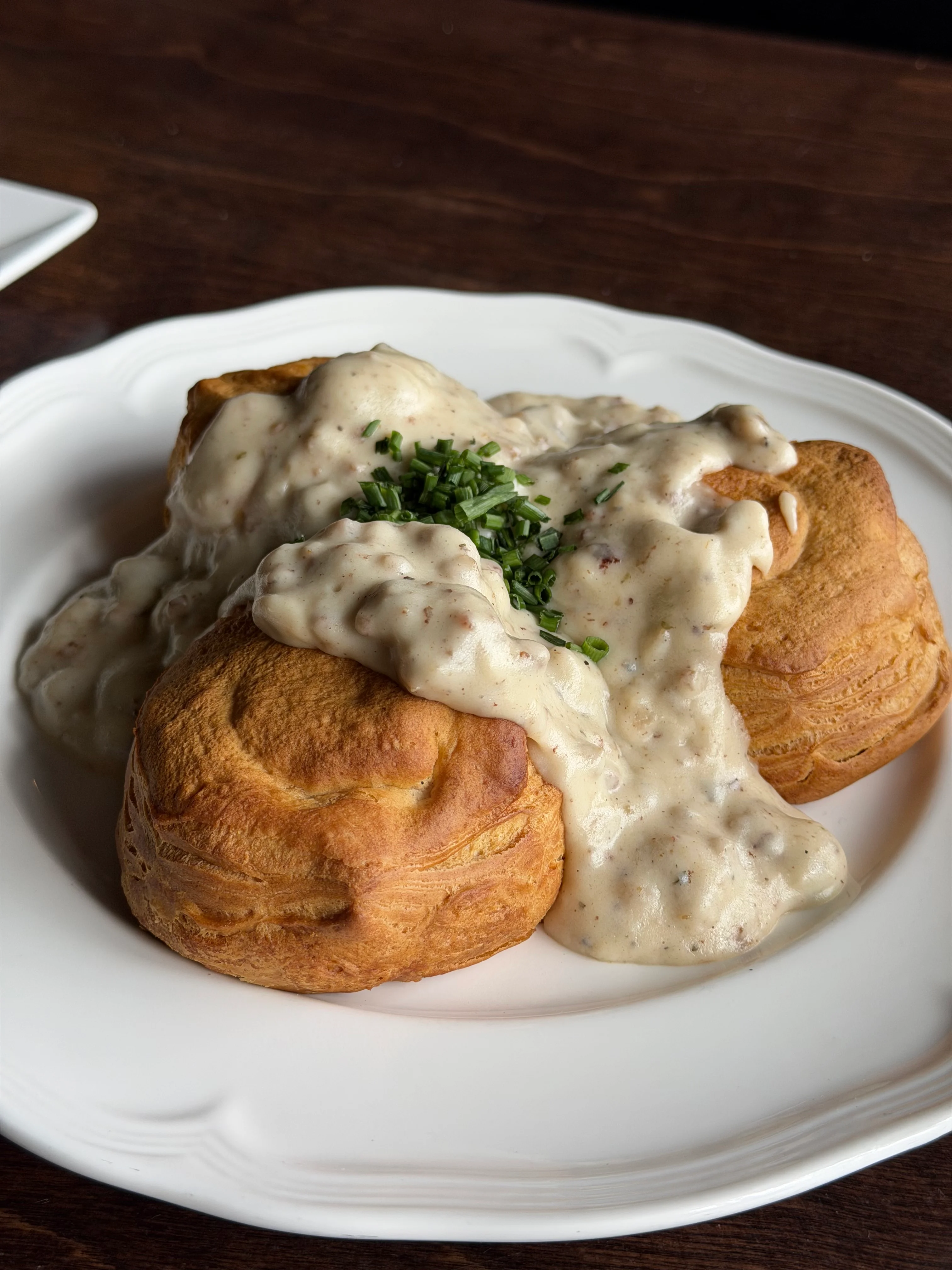 Southern biscuits and gravy topped with chives