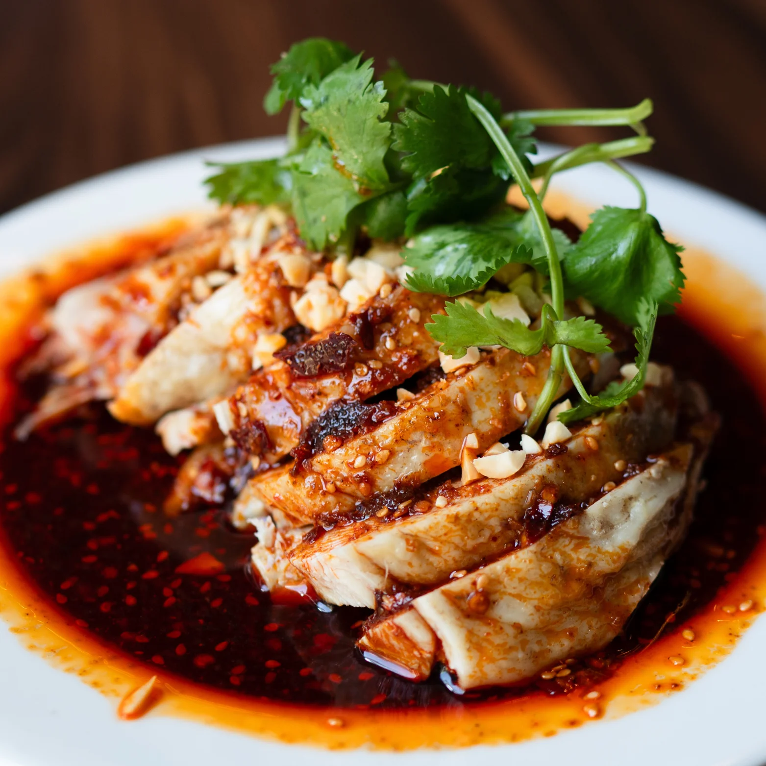 Sichuan-style spicy chicken with cilantro and peanuts
