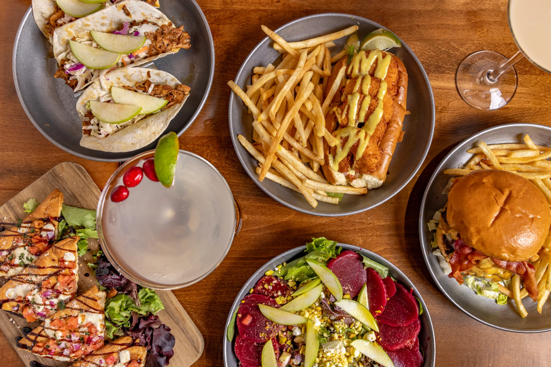 Assorted American comfort food including tacos and a burger