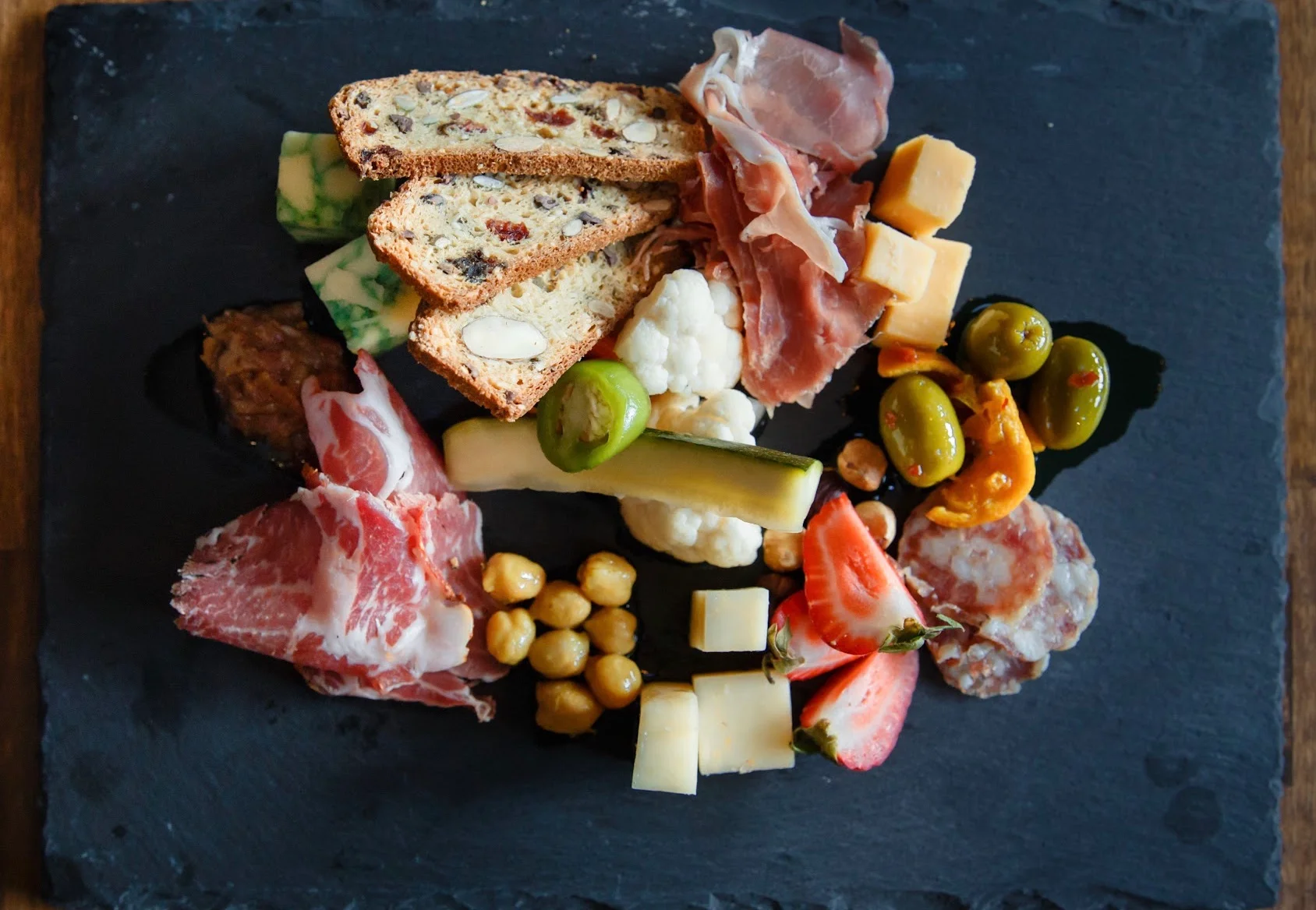 Charcuterie board featuring assorted meats and cheeses