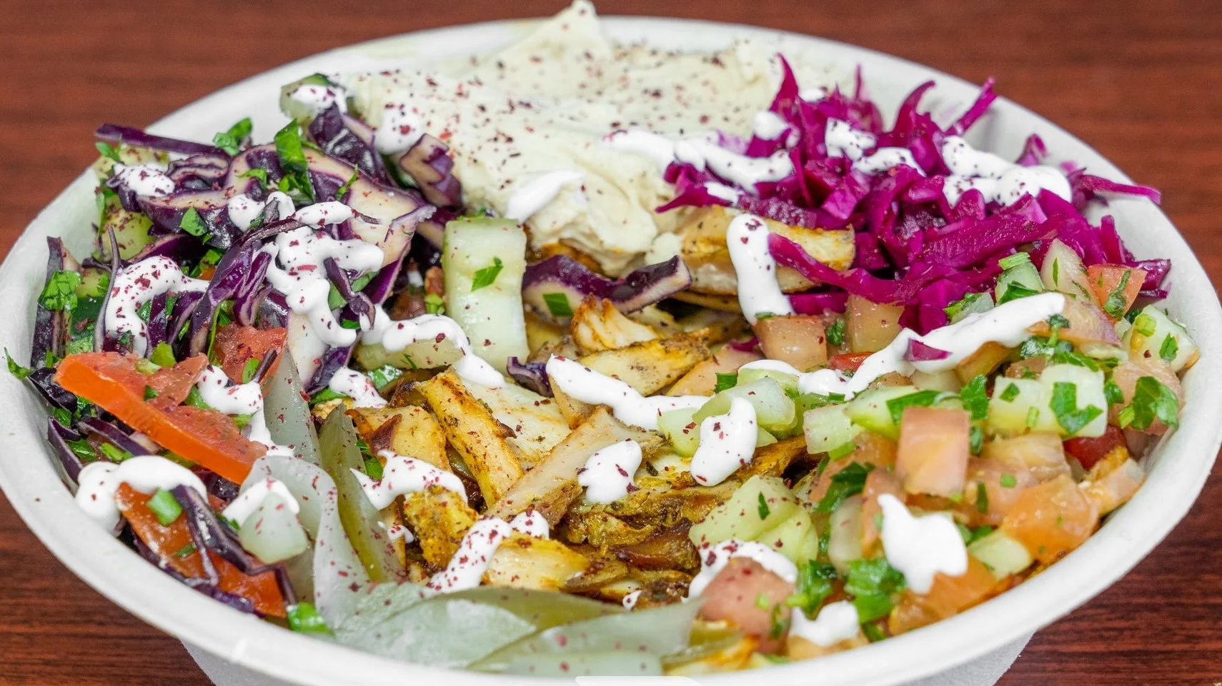 Middle Eastern chicken shawarma bowl with fresh vegetables