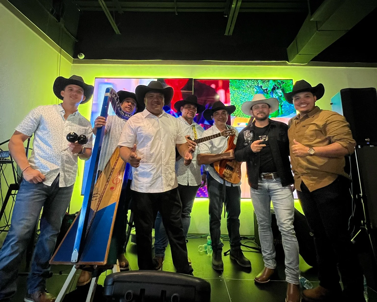 Musical group performing with instruments in a vibrant restaurant setting