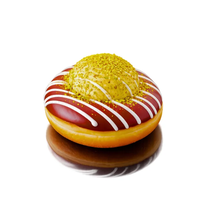 Close-up of green mochi donut with vibrant icing and creative toppings