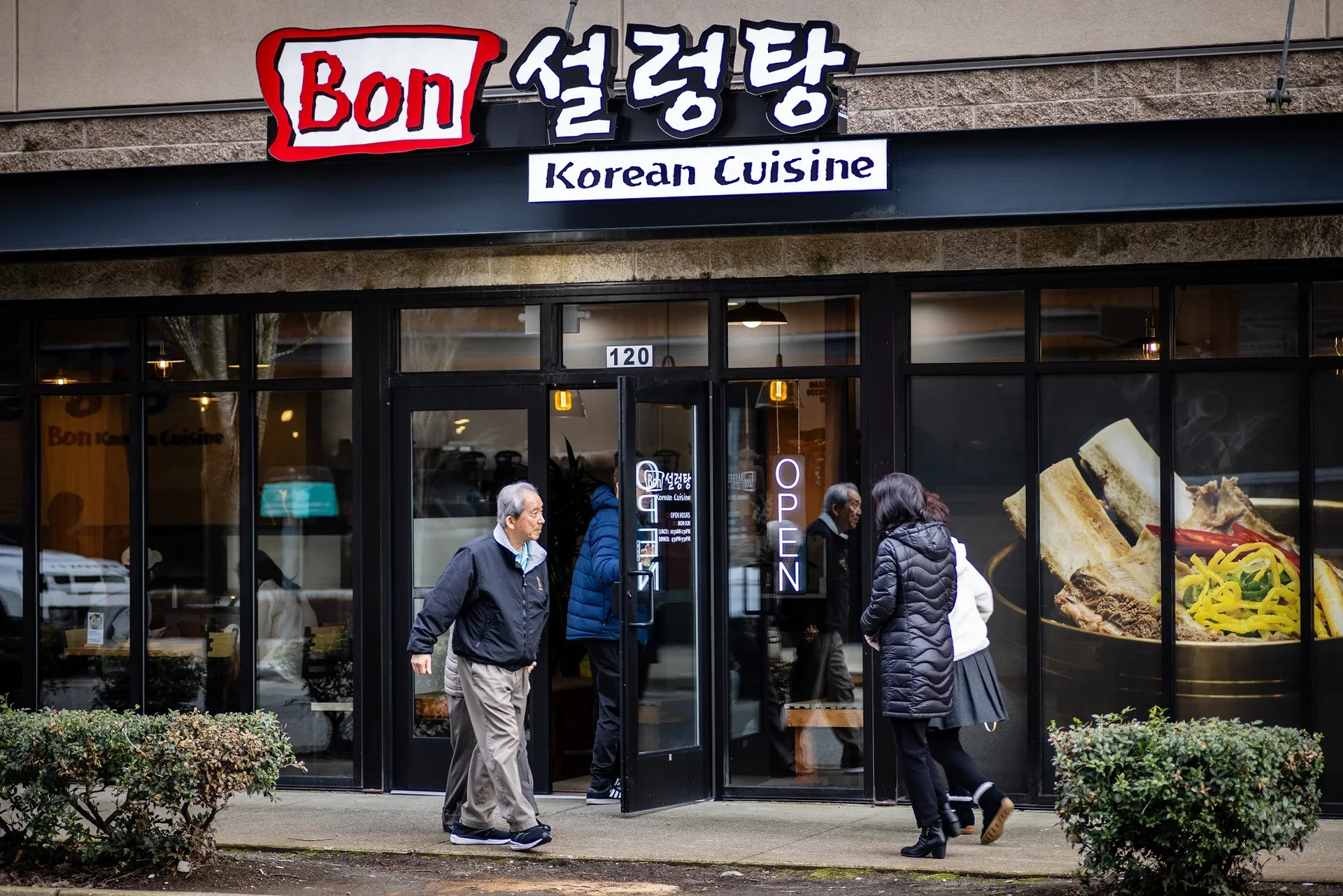 Korean restaurant exterior with open sign and traditional decor
