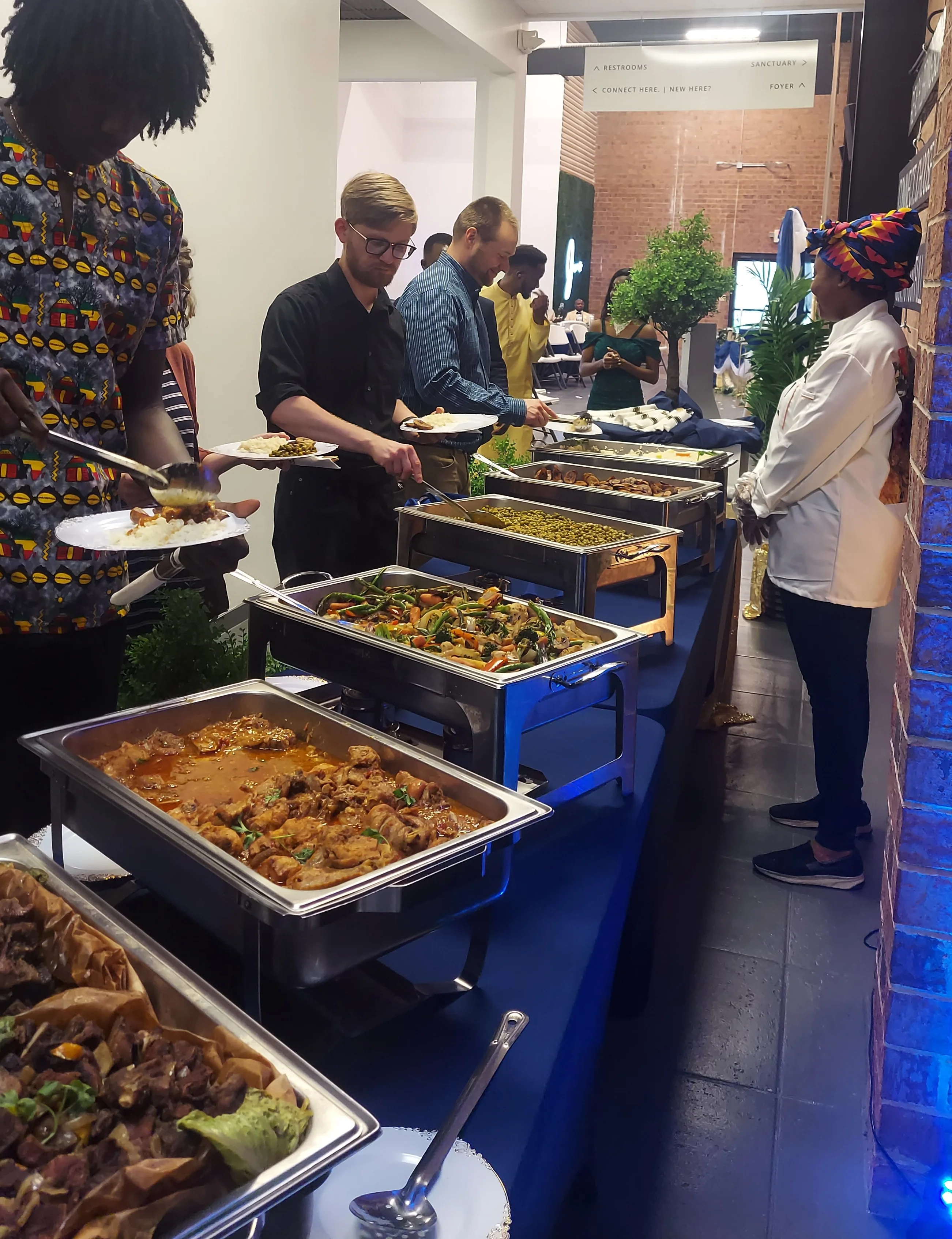 Buffet of West African jollof rice and assorted dishes