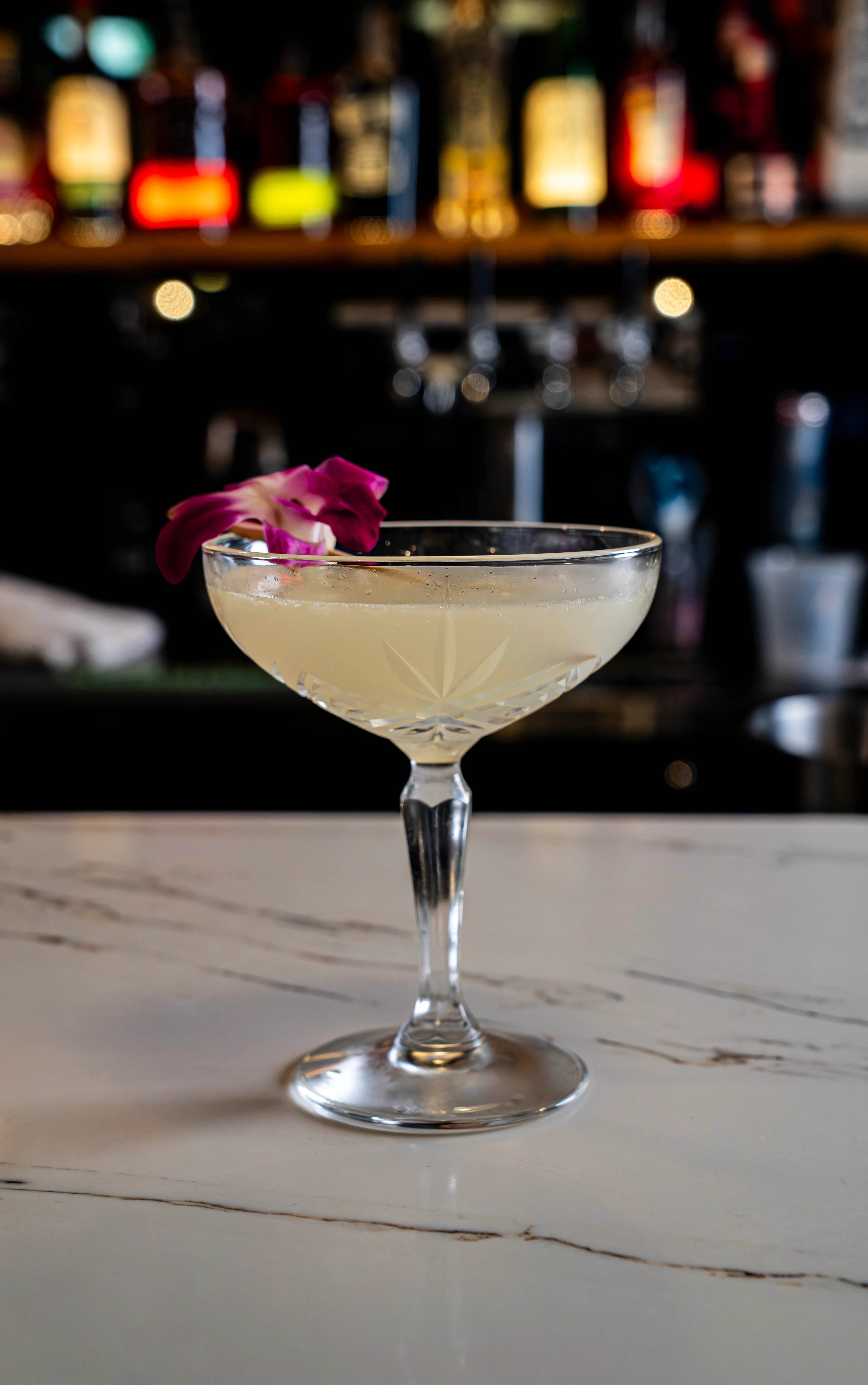 A refreshing Pear Lychee Martini garnished with a slice of pear.