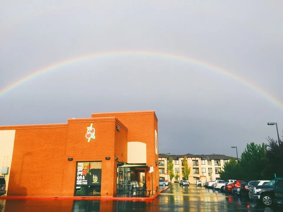 Restaurant exterior with a rainbow in the background