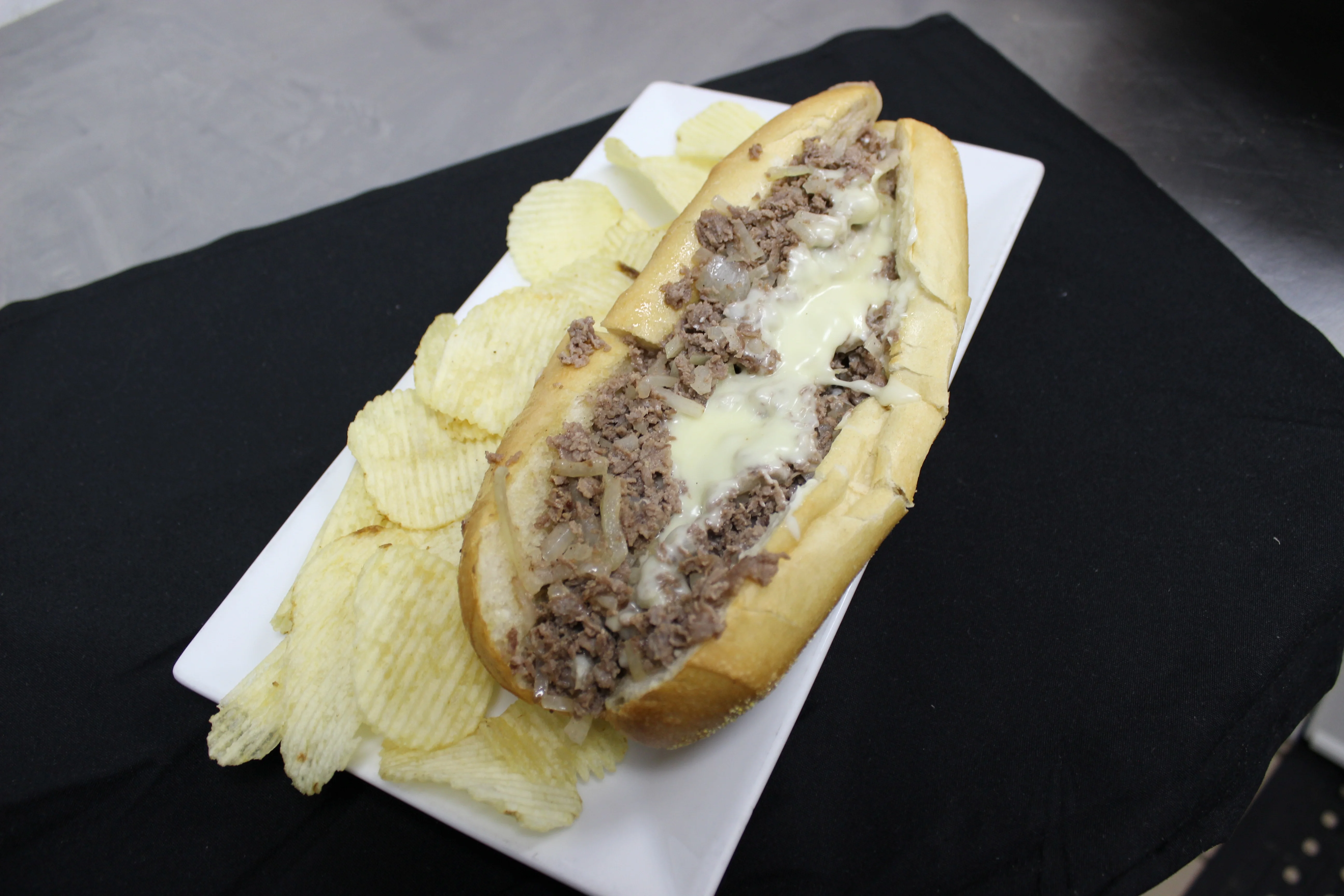 Classic Philly cheesesteak sandwich with melted cheese