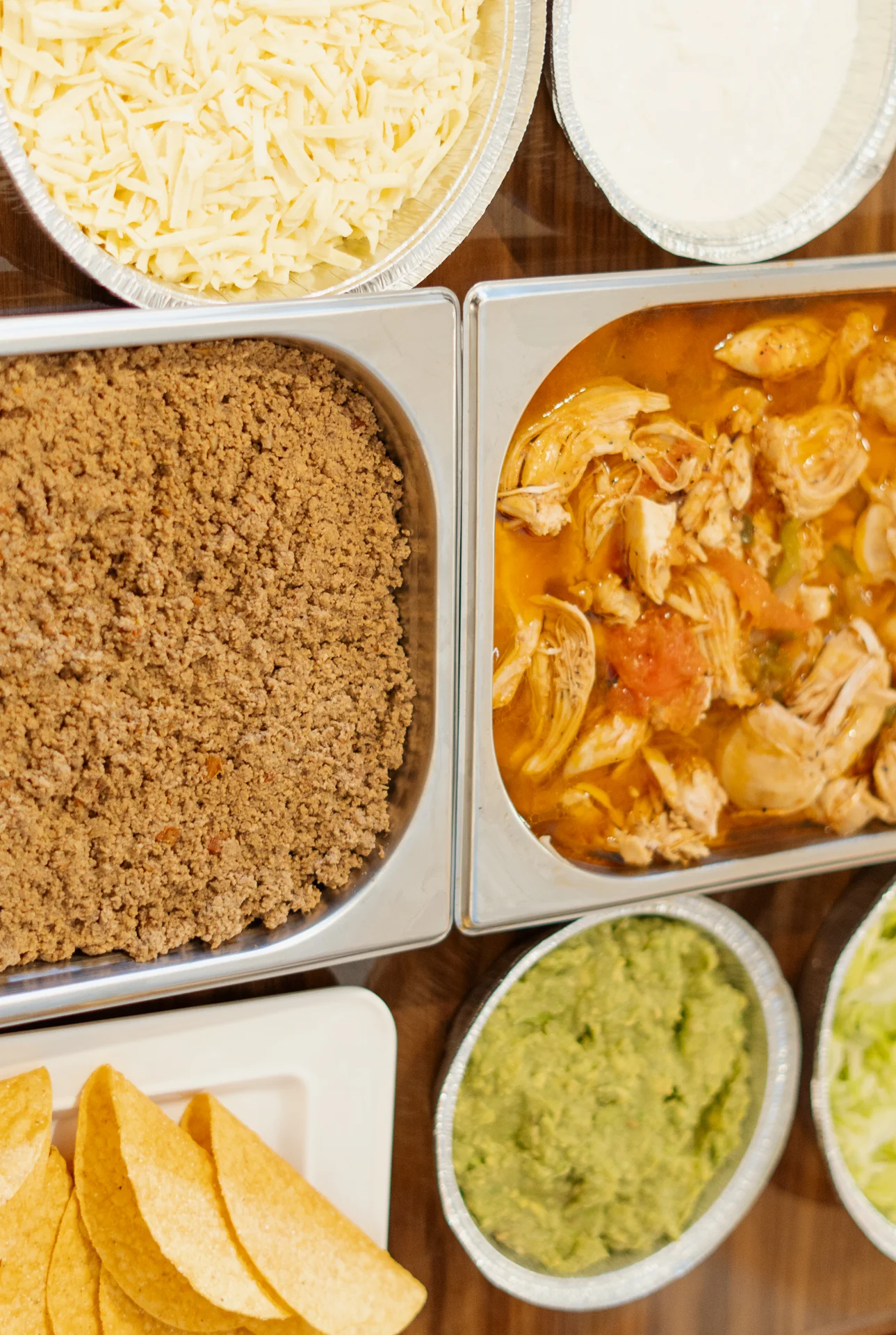 Mexican taco bar with seasoned chicken and toppings