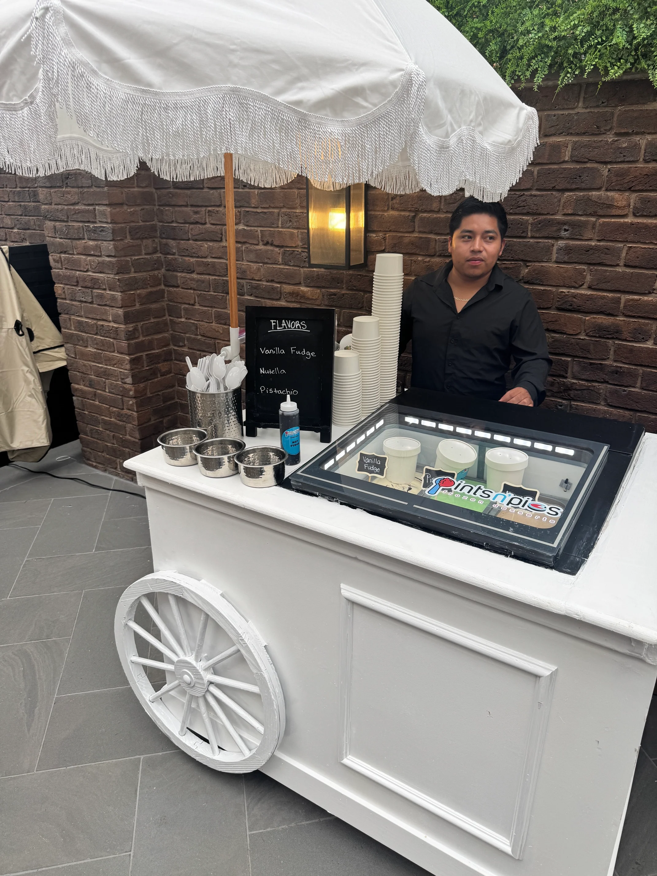 Ice cream cart with flavors like vanilla fudge and pistachio