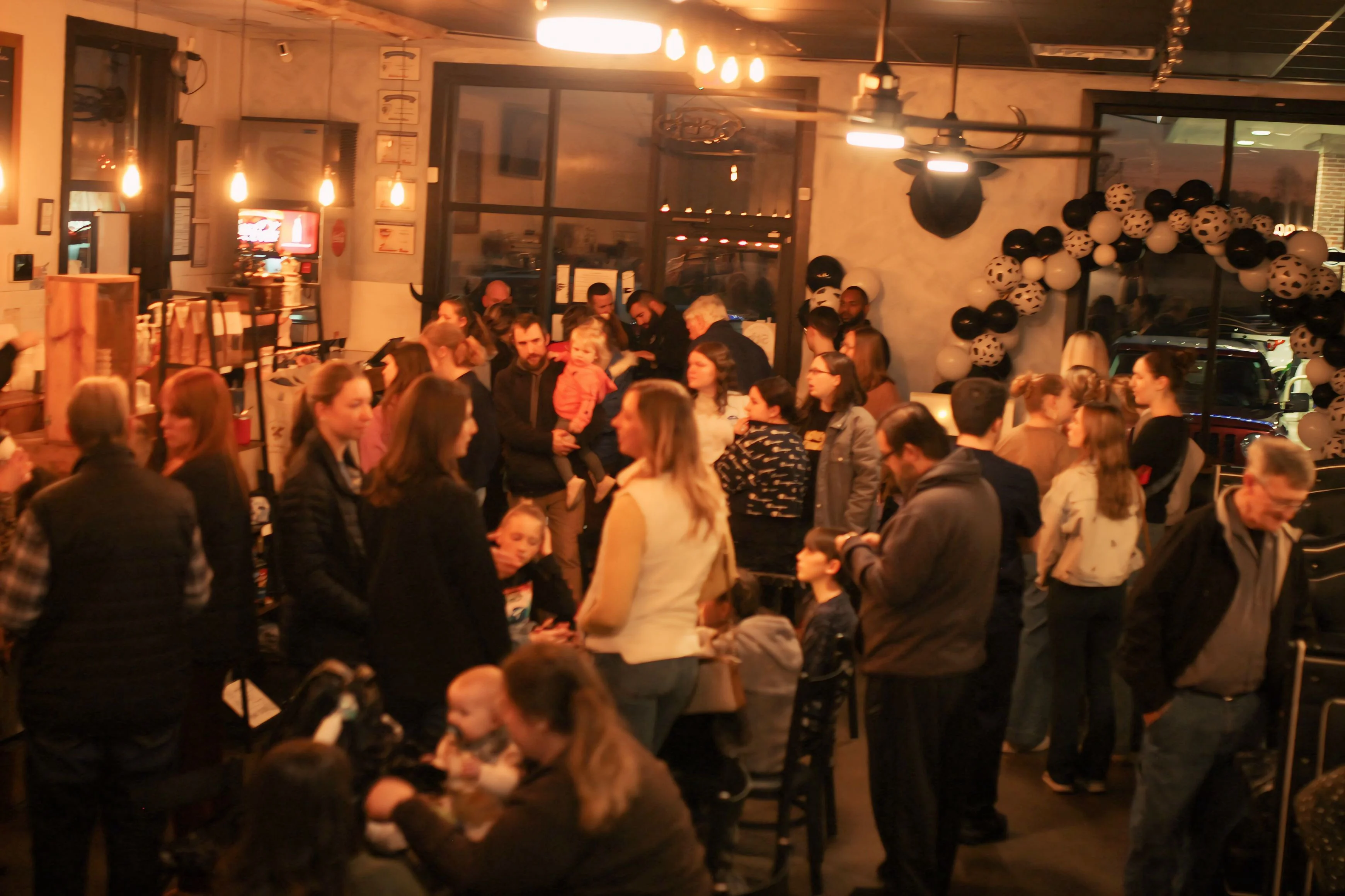 Busy restaurant interior filled with patrons enjoying a lively atmosphere