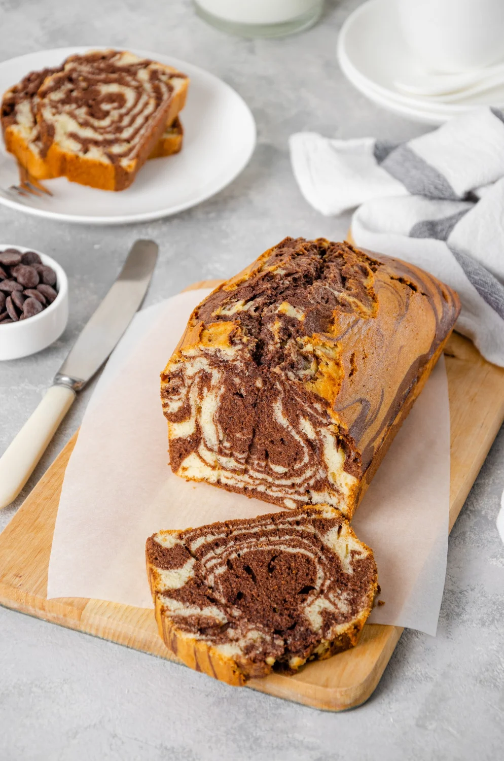 Swirled chocolate marble loaf cake on a wooden board