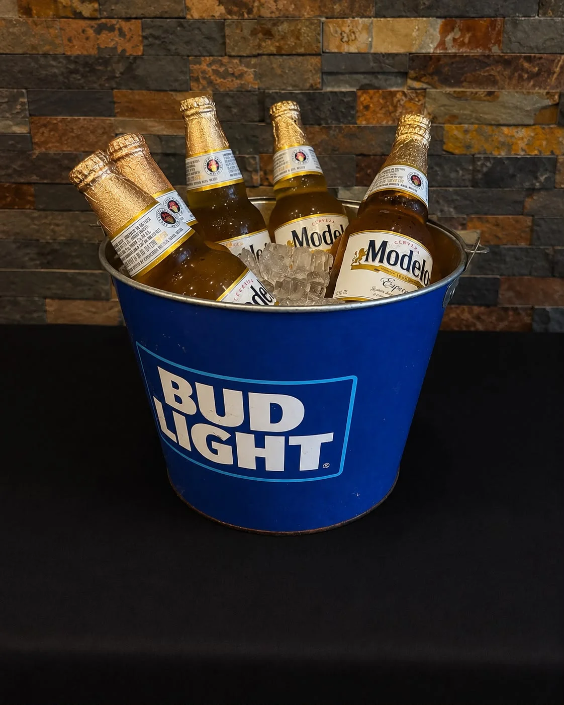 Chilled beers in a bucket at a lively bar