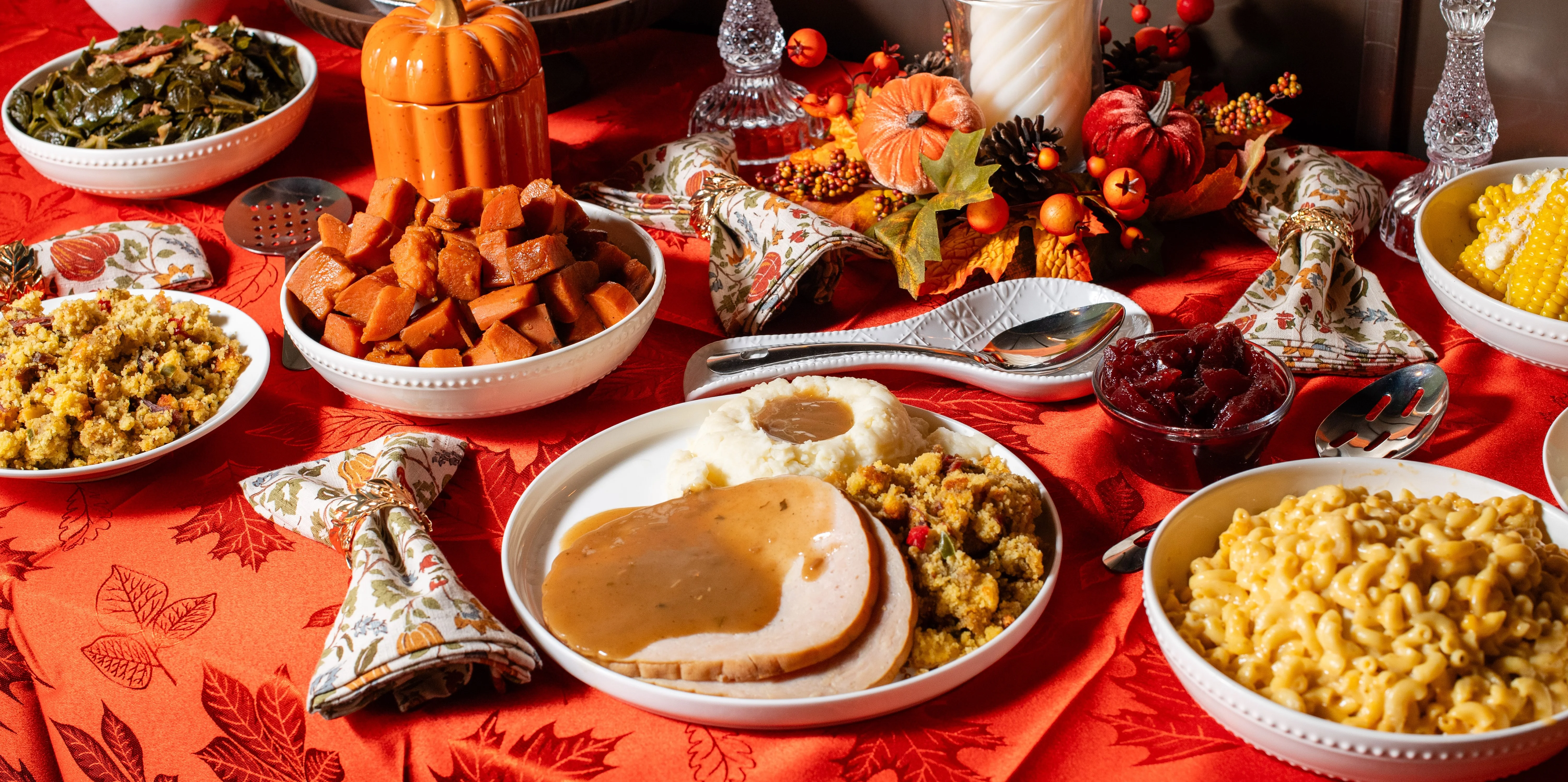 Traditional American Thanksgiving dinner with turkey, stuffing, corn, carrots, and macaroni