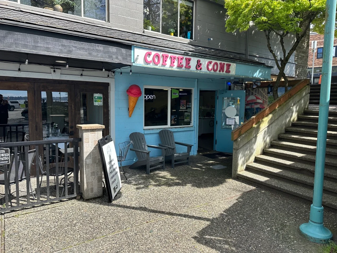 Charming coffee shop exterior with ice cream cone sign
