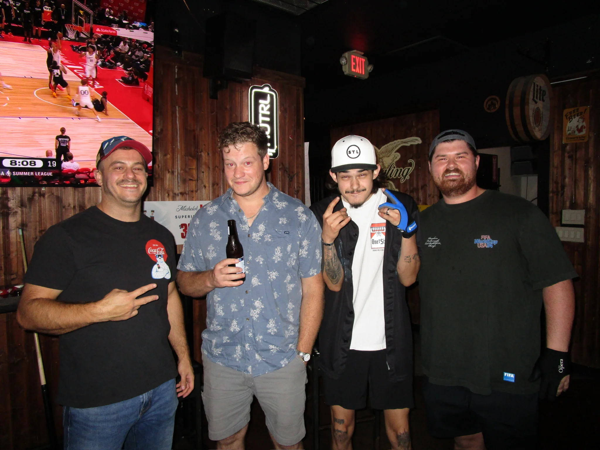 Group of friends enjoying drinks in a lively bar atmosphere