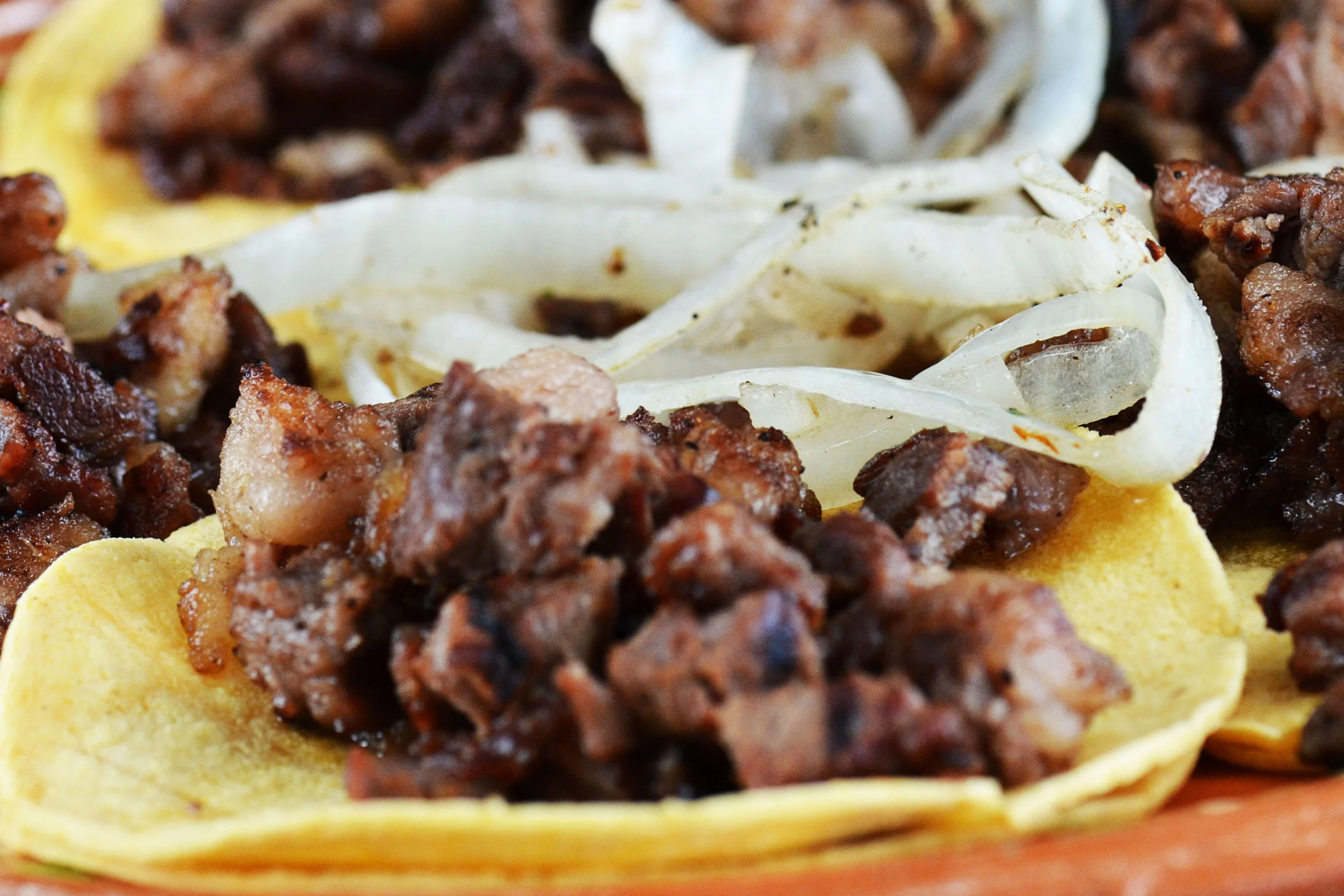 Authentic Mexican tacos with grilled meat and onions