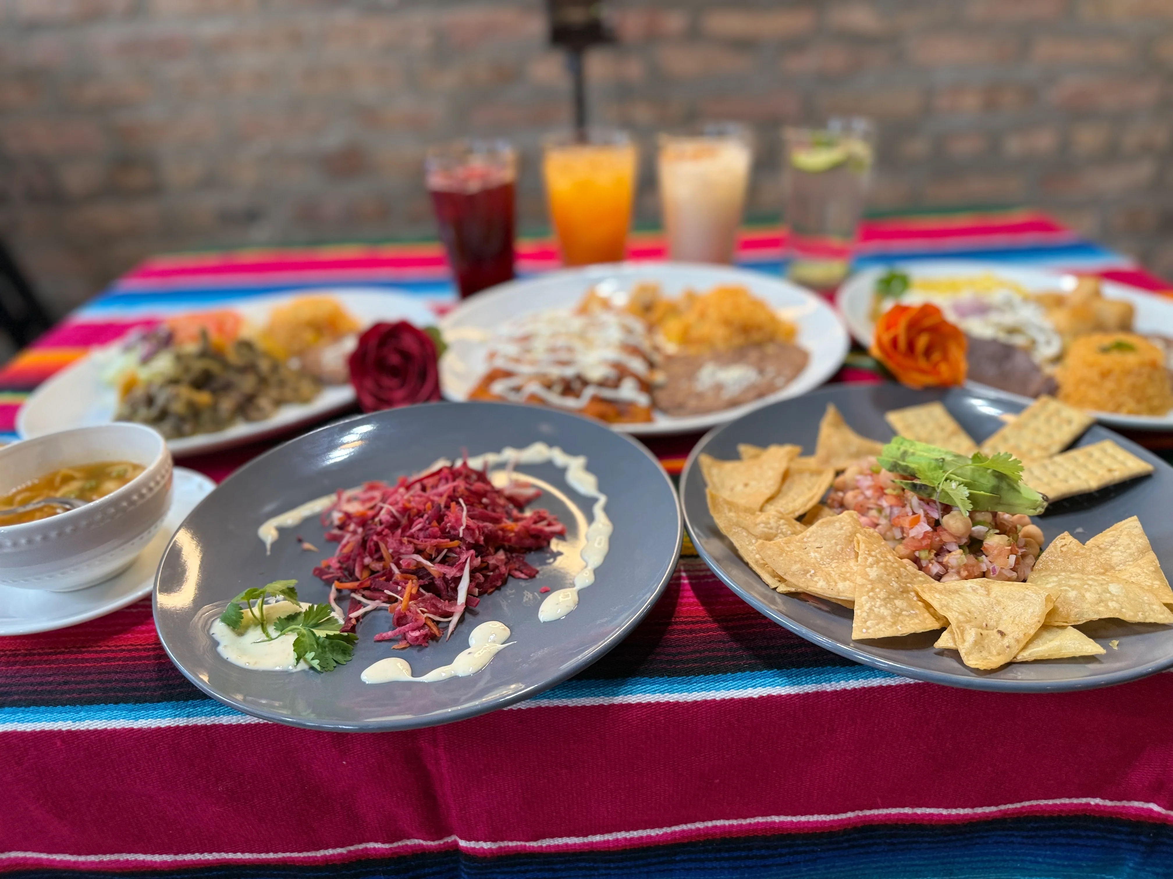 Colorful Mexican feast with nachos, salads, and traditional dishes