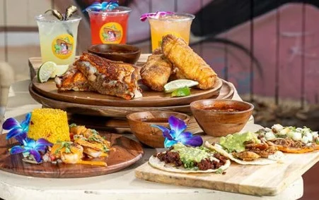Colorful Mexican platter with tacos and seafood