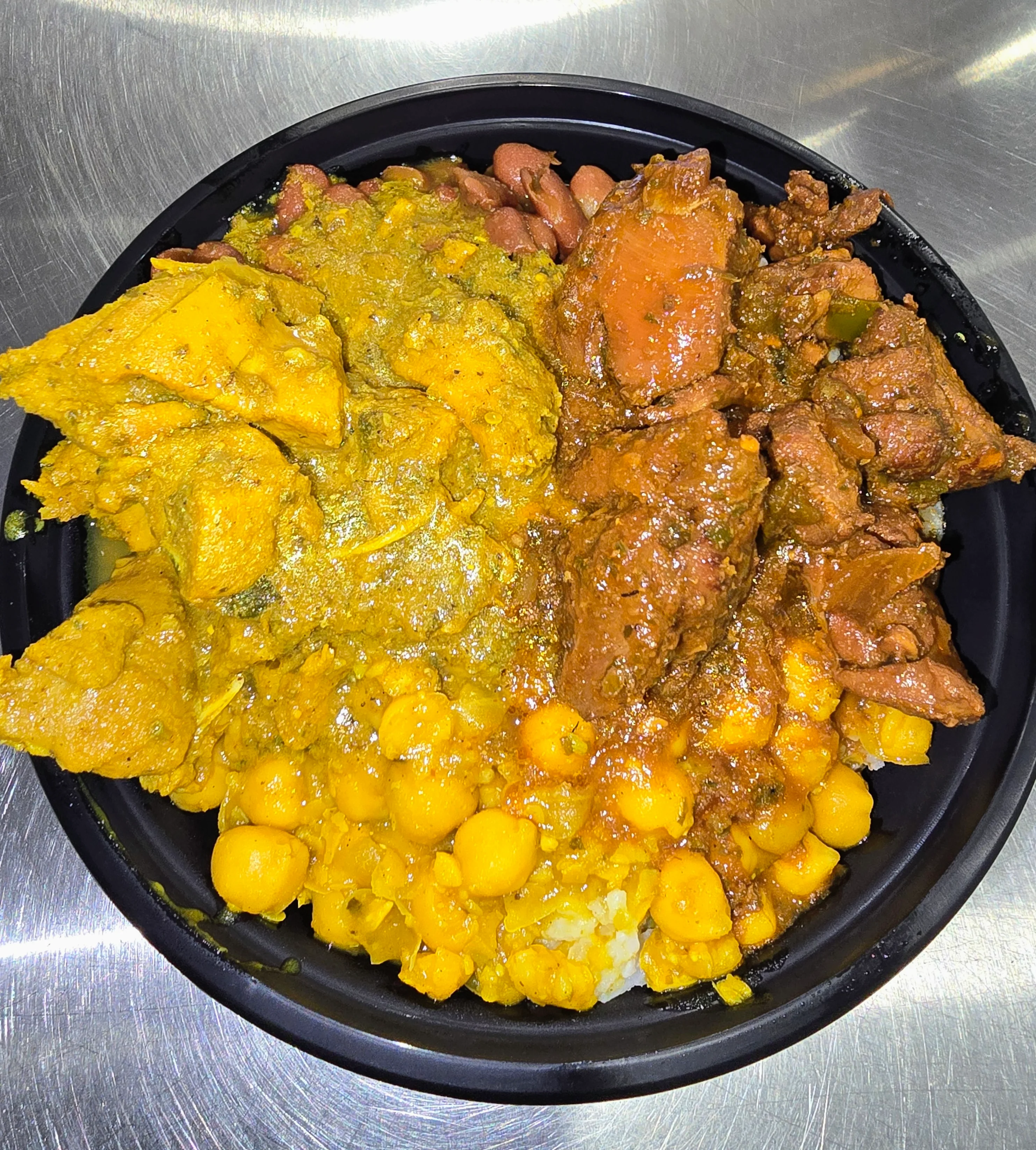 Jamaican curry chicken with rice and beans